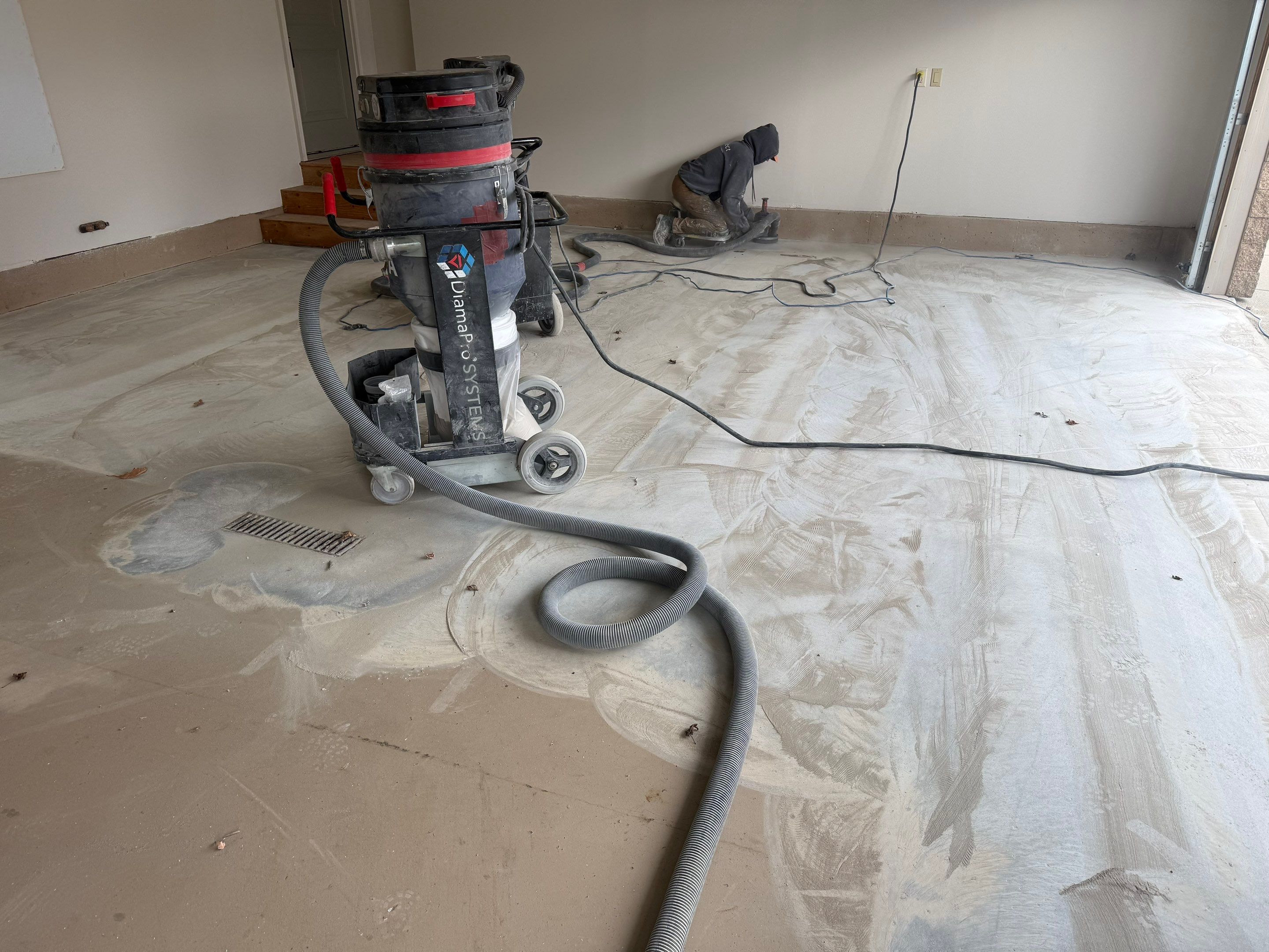 Residential Garage Floor Coating with Grey Speckled Epoxy Finish by Select Painting, Coatings & Garage Cabinets