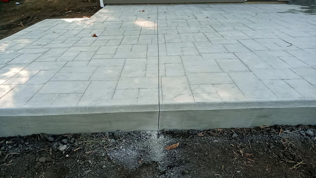 Back Yard Cantilivered Patio by LAND ESCAPES LLC