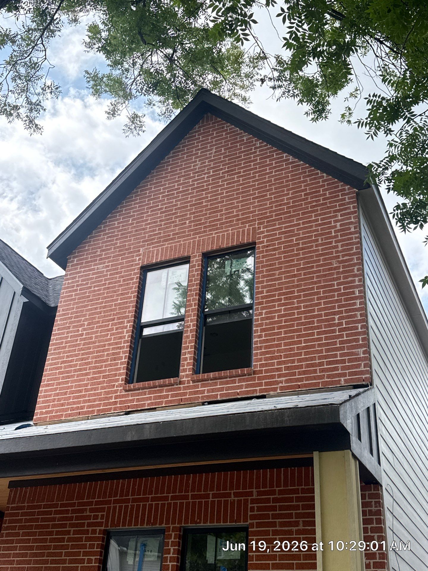 Midtown Elegance: Brickwork with Slurry Finish Refinement by Apex Conventional Stucco Llc