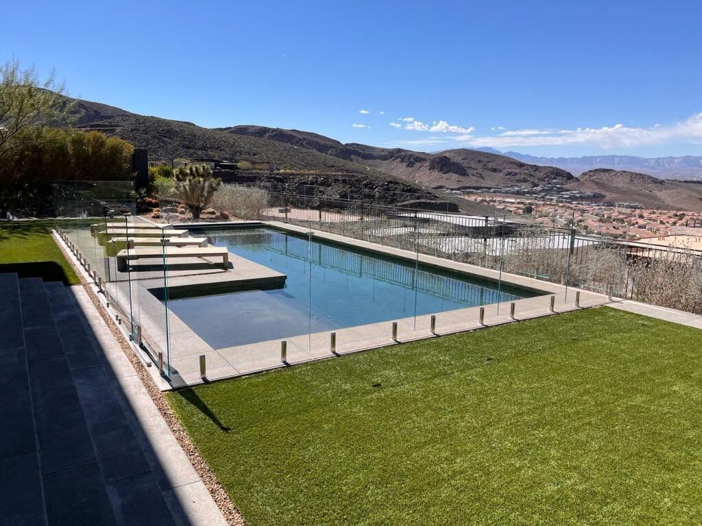 Exterior wood refinish & glass pool enclosure by Level Builders