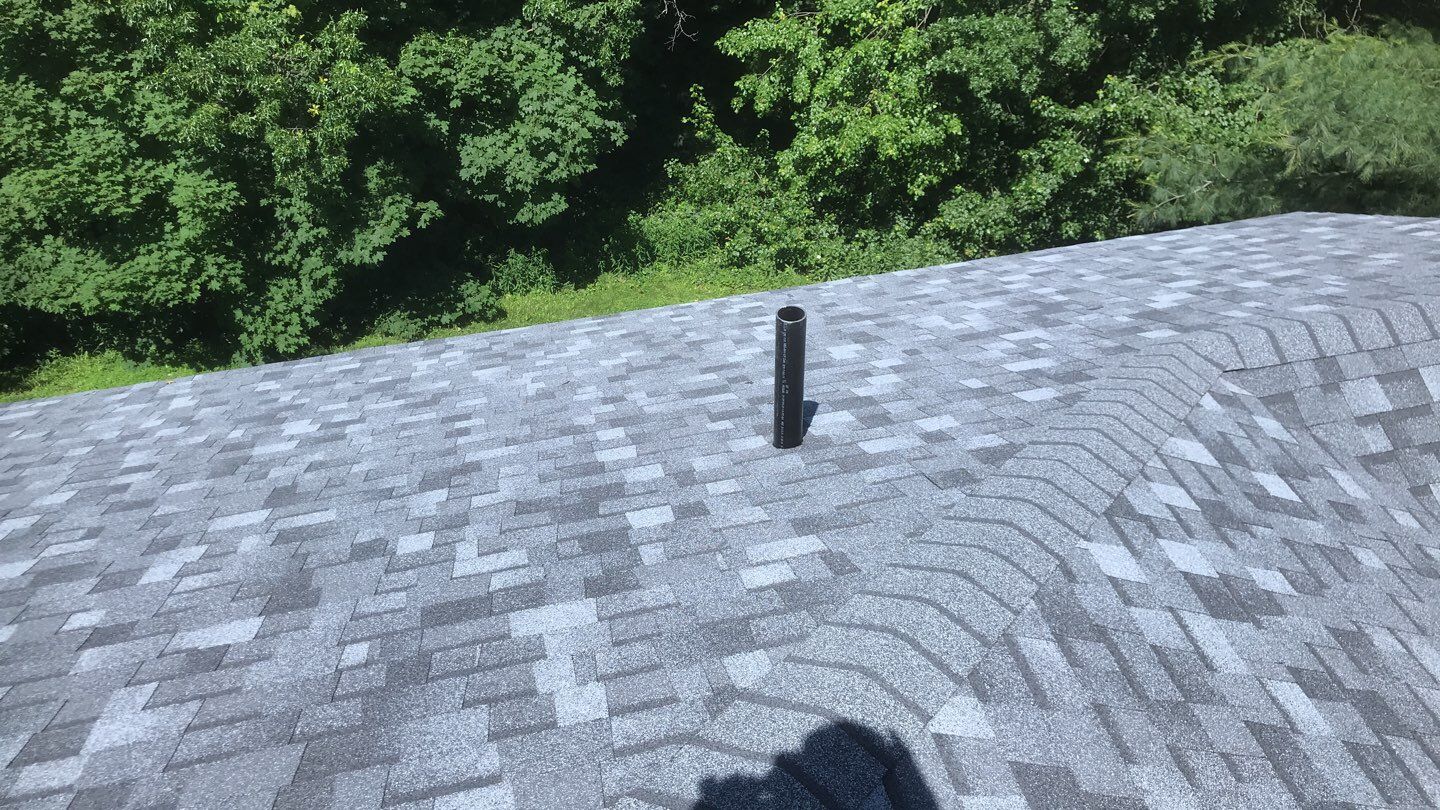 Commercial Roofing Installation using EPDM with white gutters by A Plus Exterior