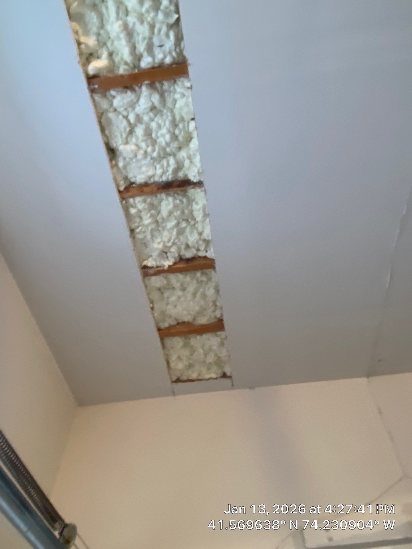 Garage ceiling using open cell spray foam by NYS Foam & Energy