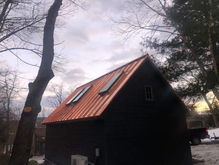 Standing Seam Metal Roof using Copper by CMNG LLC