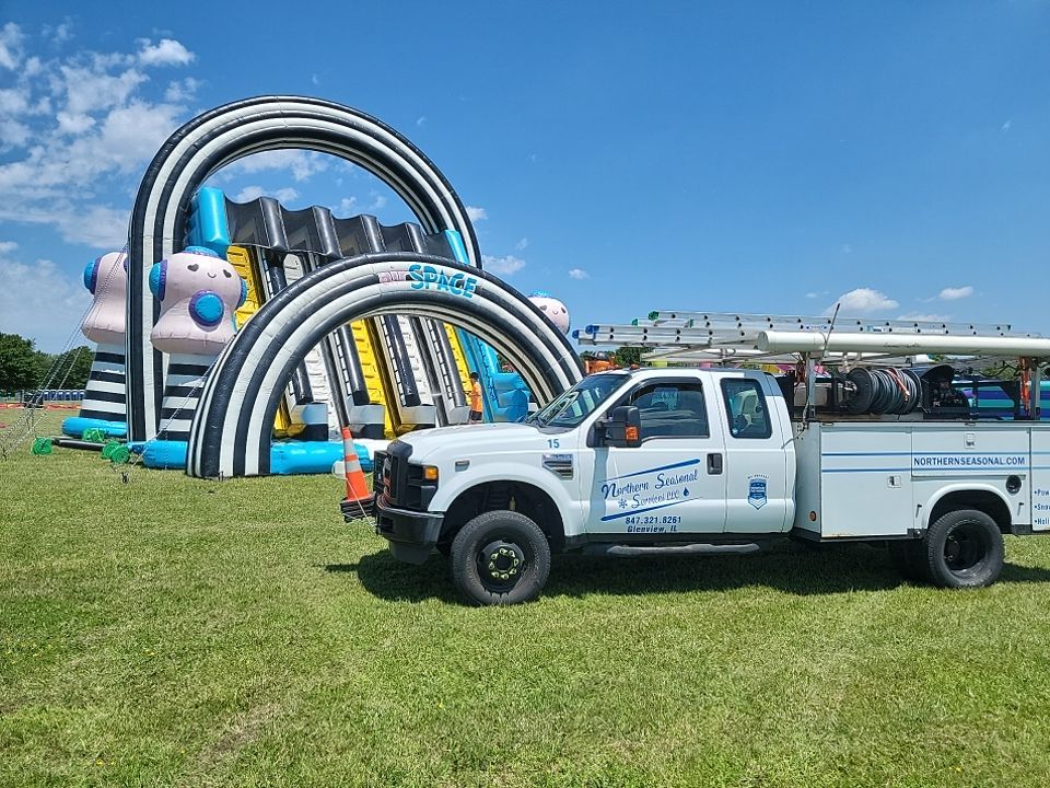 Cleaning for big bounce america prior to a large event by Northern Power Washing LLC.