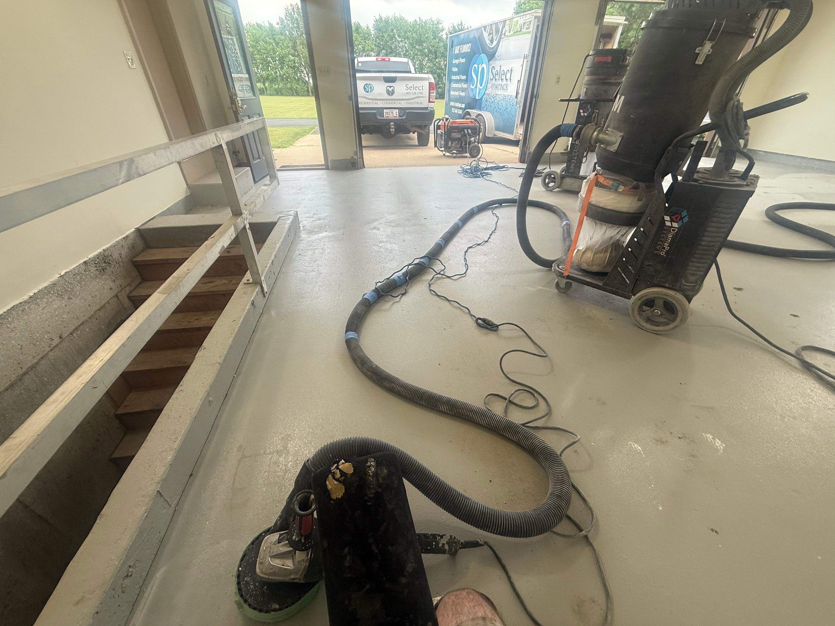 Custom Polyaspartic Garage Floor and Stairwell Coating in Pipestone by Select Painting, Coatings & Garage Cabinets