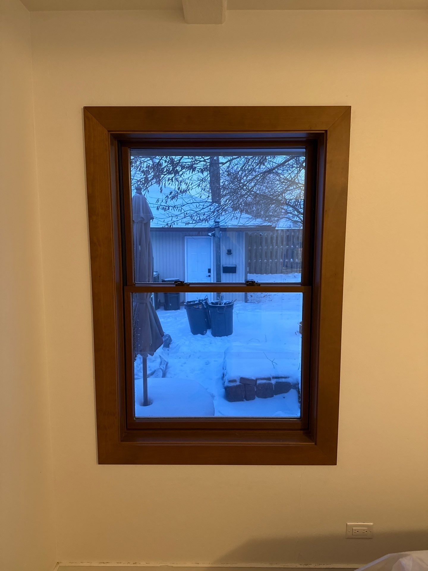 Black-Frame Pella Lifestyle Upgrade on a Partial Brick Home by United Windows and Siding LLC