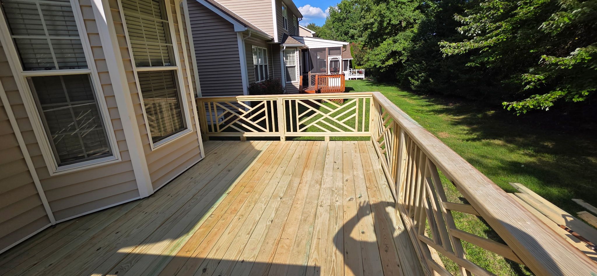Raleigh Wooden Deck Resurfacing and Decorative Lattice Railing Upgrade by The Remodeling Company