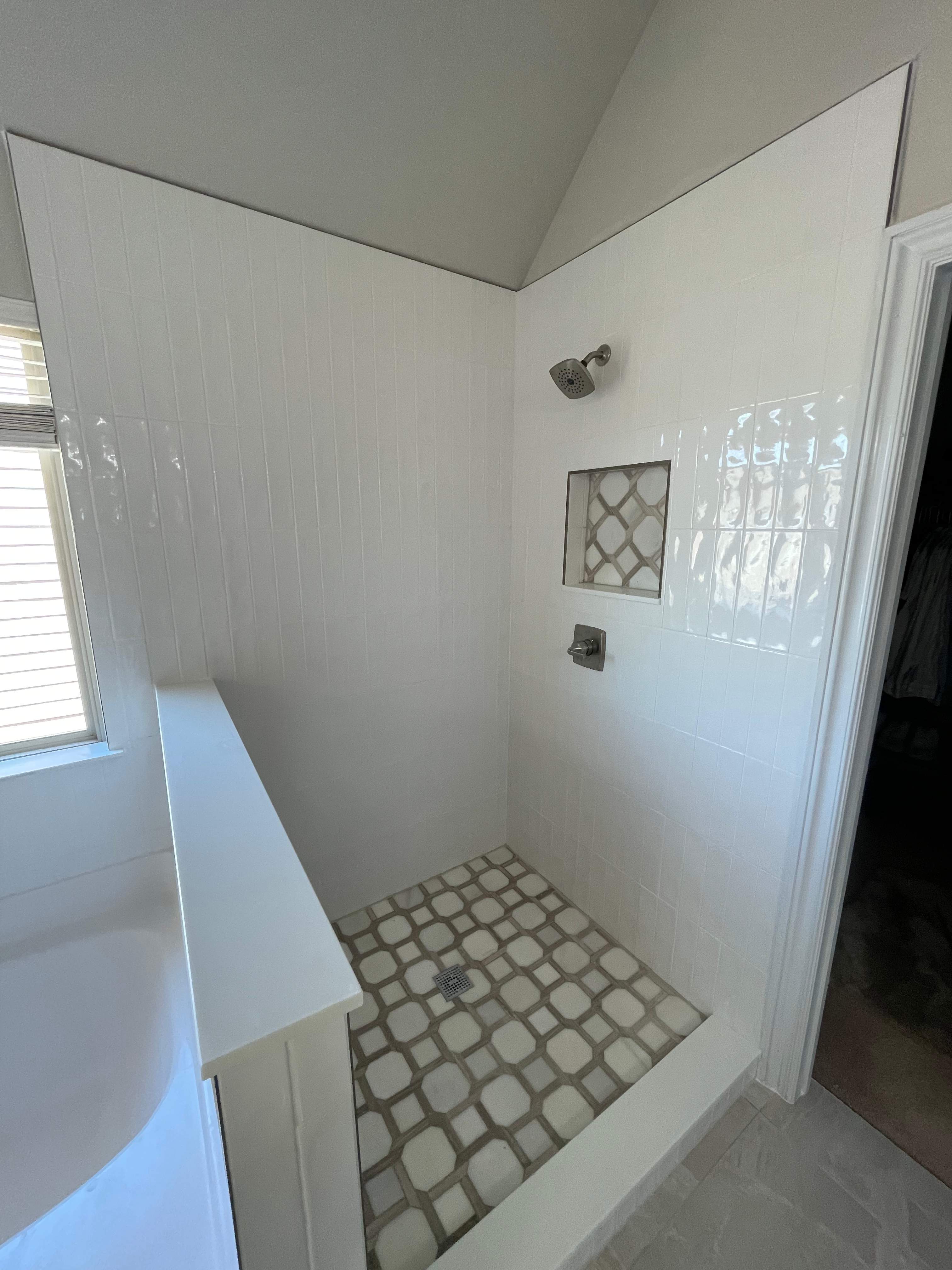 Shower retile and bathroom flooring by Prudencio