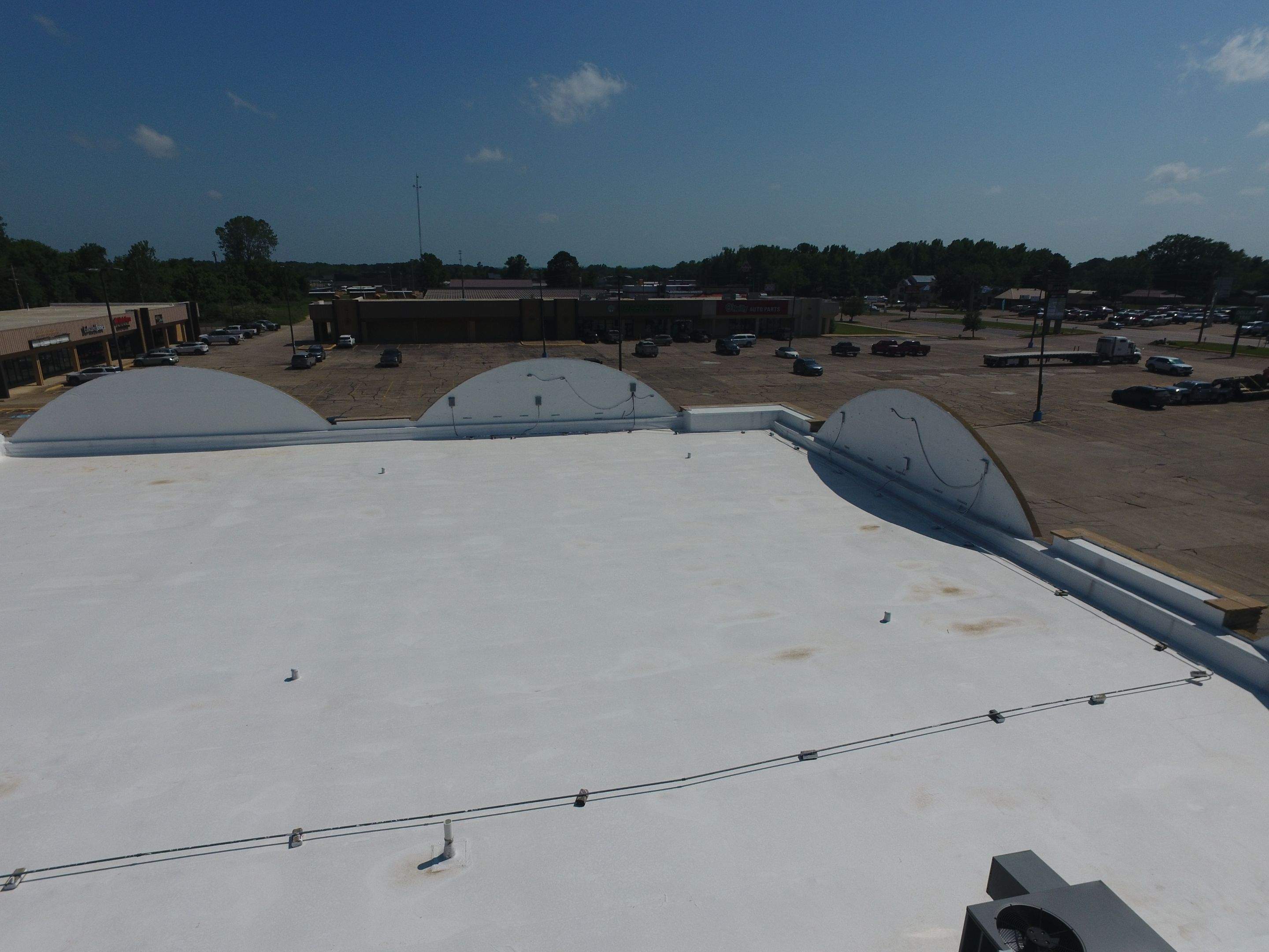 Commercial Roofing Installation using Aldocoat Coatings by Hostetler Roofing