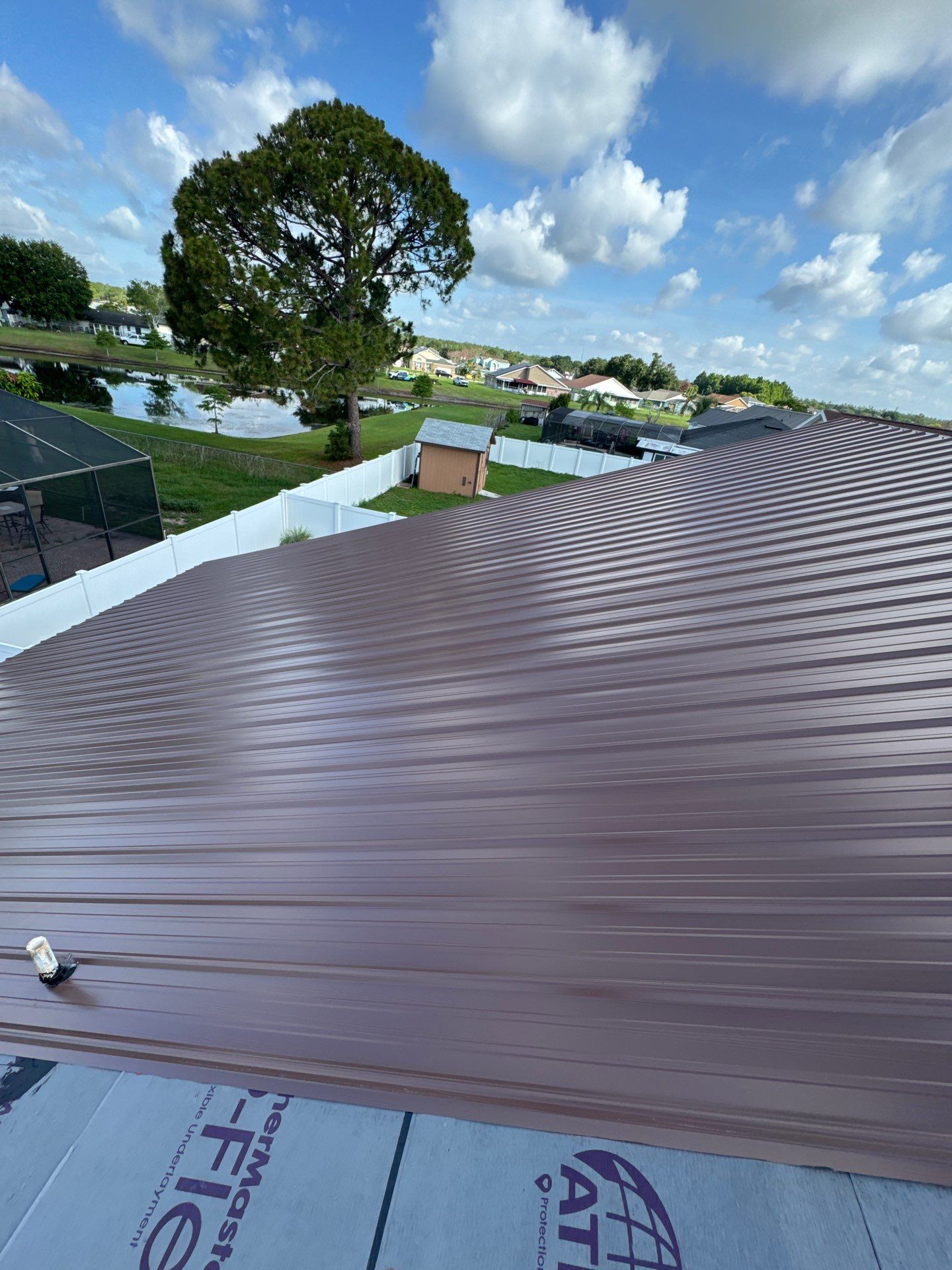 Residential Metal Roofing Installation and Gutter Replacement in Kissimmee by Pinnacle Roofing Group