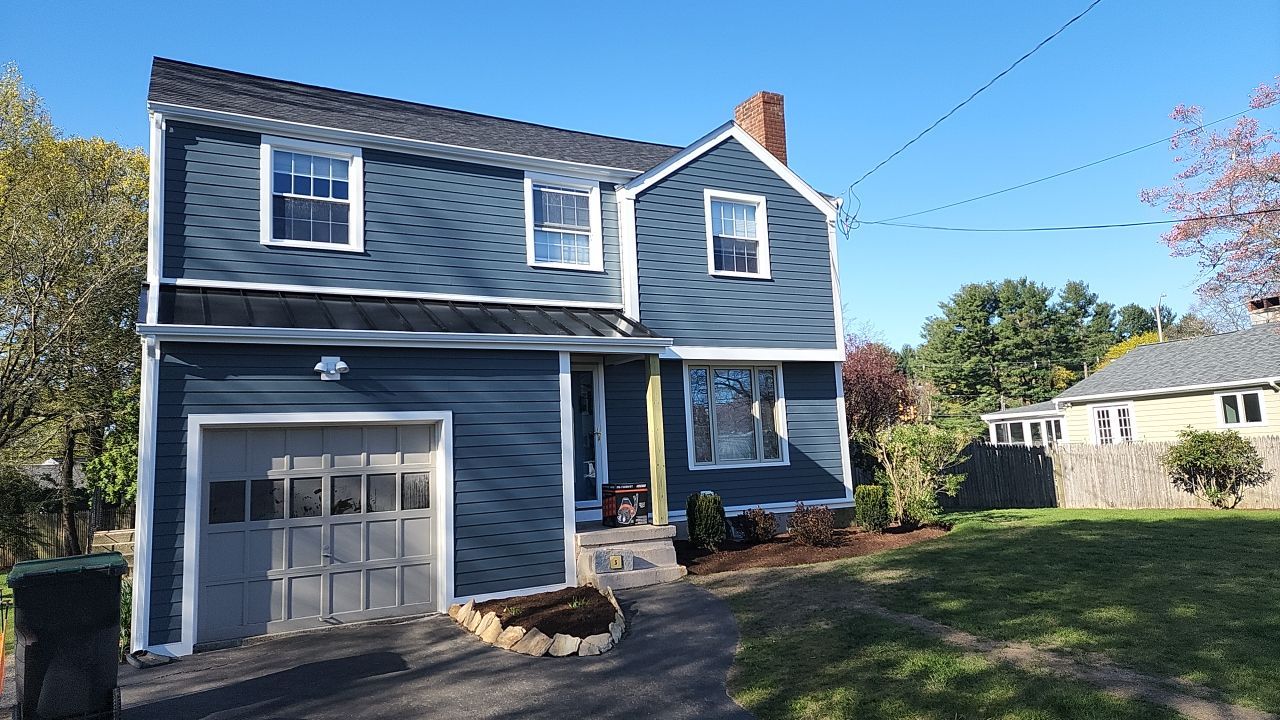 James Hardie siding, new metal roof and couple windows being installed. by UBrothers Construction