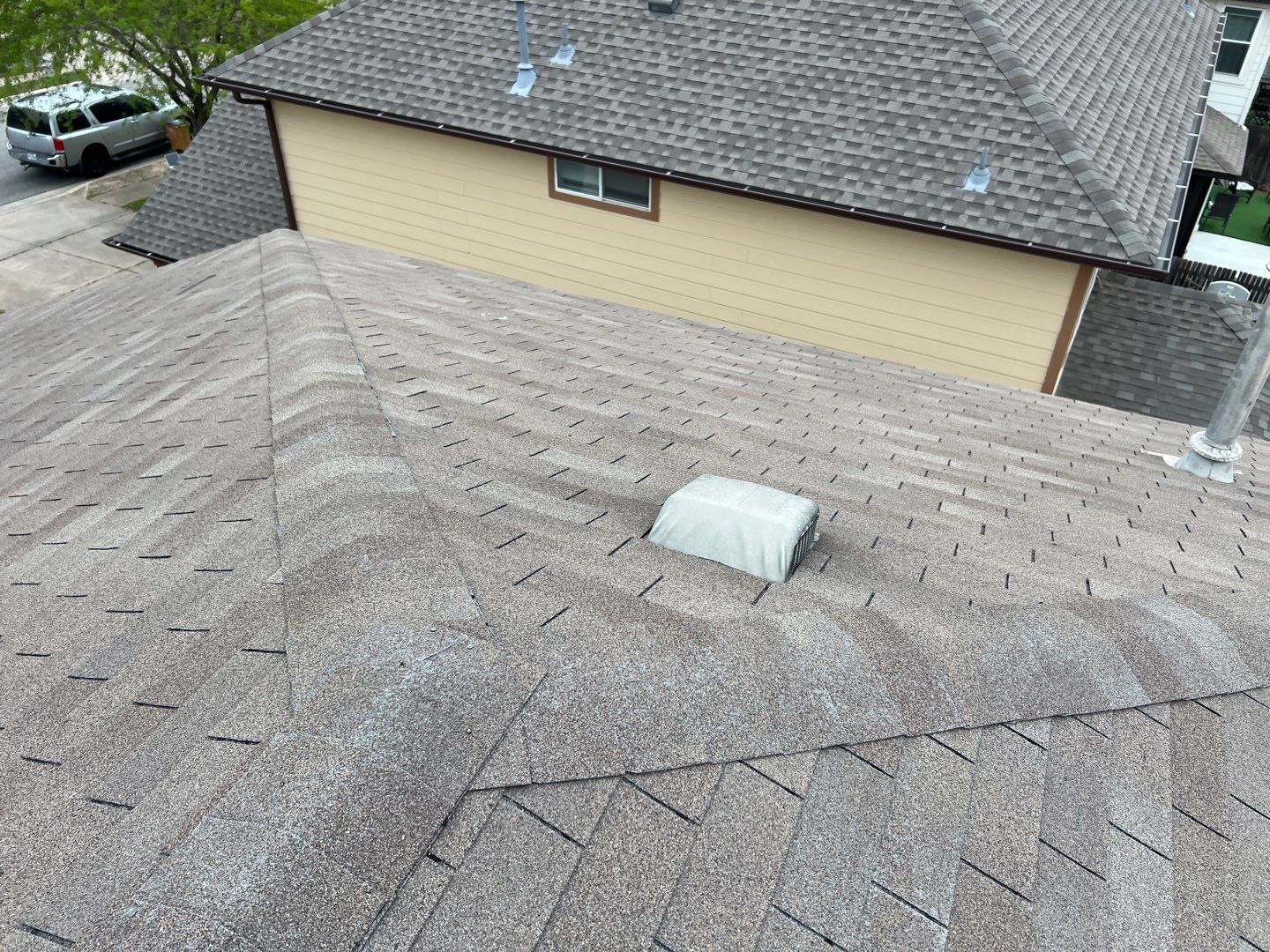 Wind damaged roof replacement by Oakwood Roofing and Construction, LLC