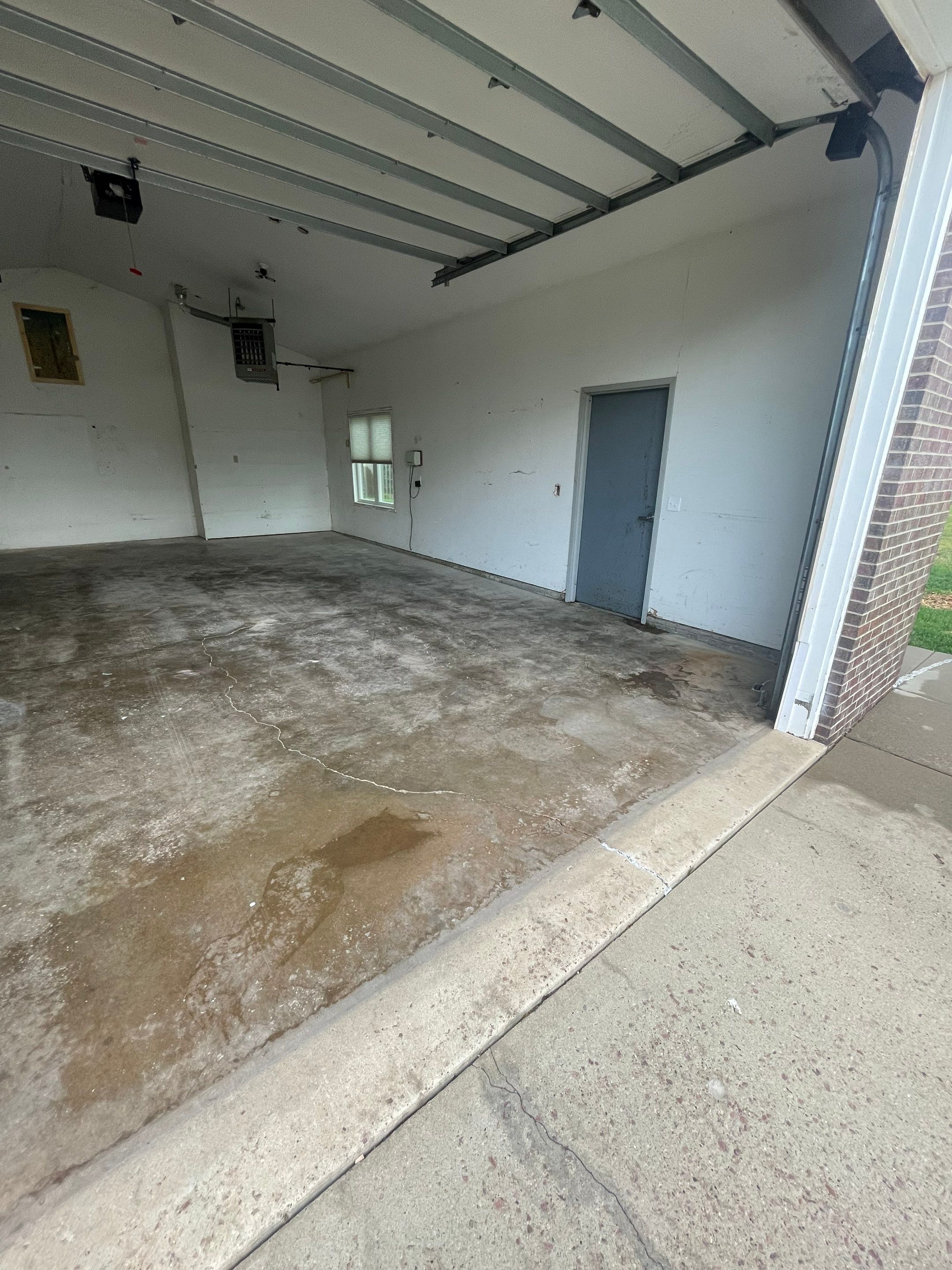 Coyote Flake Concrete Coating for Sioux Falls Garage by Select Painting, Coatings & Garage Cabinets