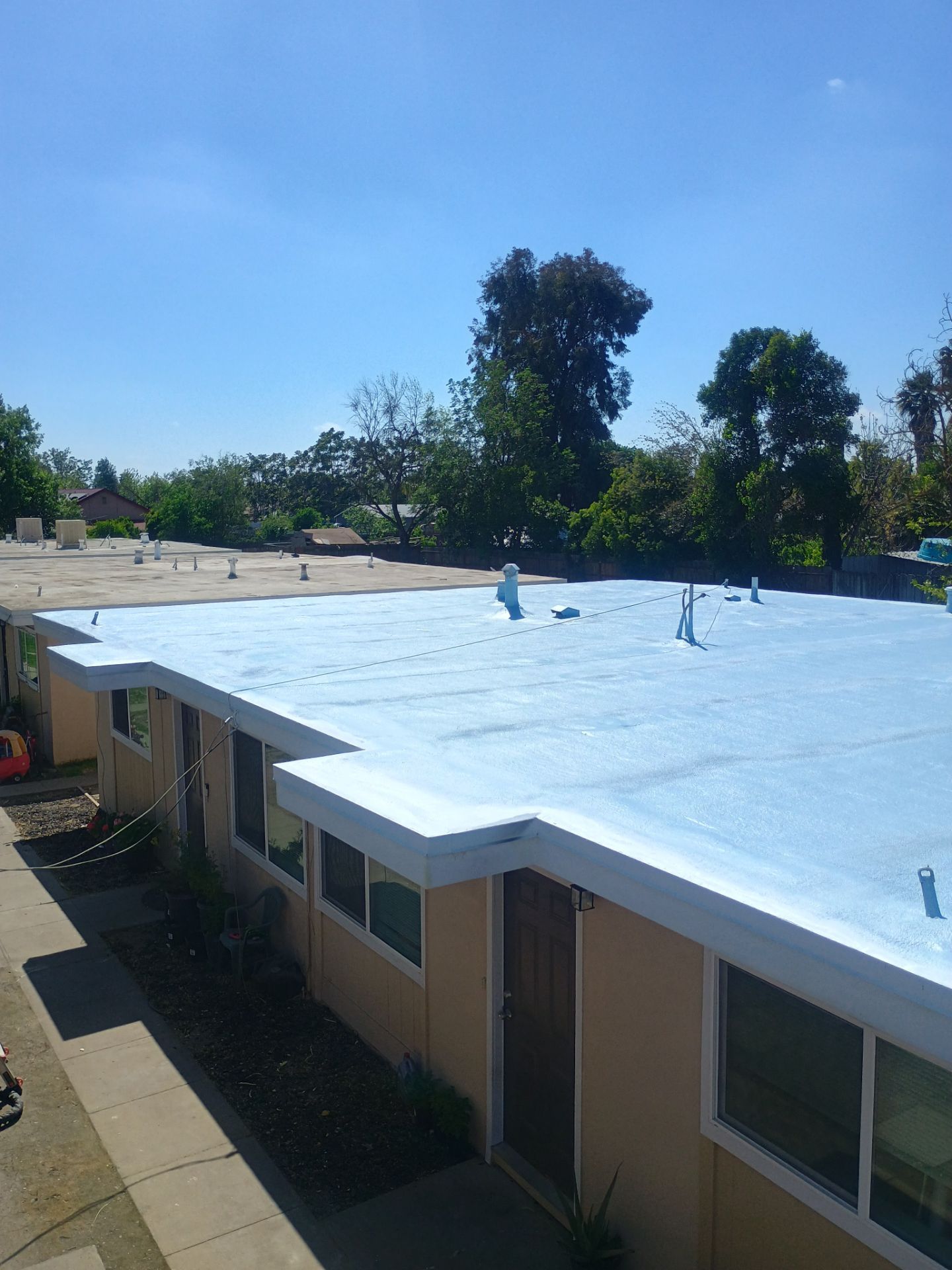 Foam Refurbish using Conklin Benchmark/PUMA XL coatings and spray foam by Straight Edge Roofing Inc