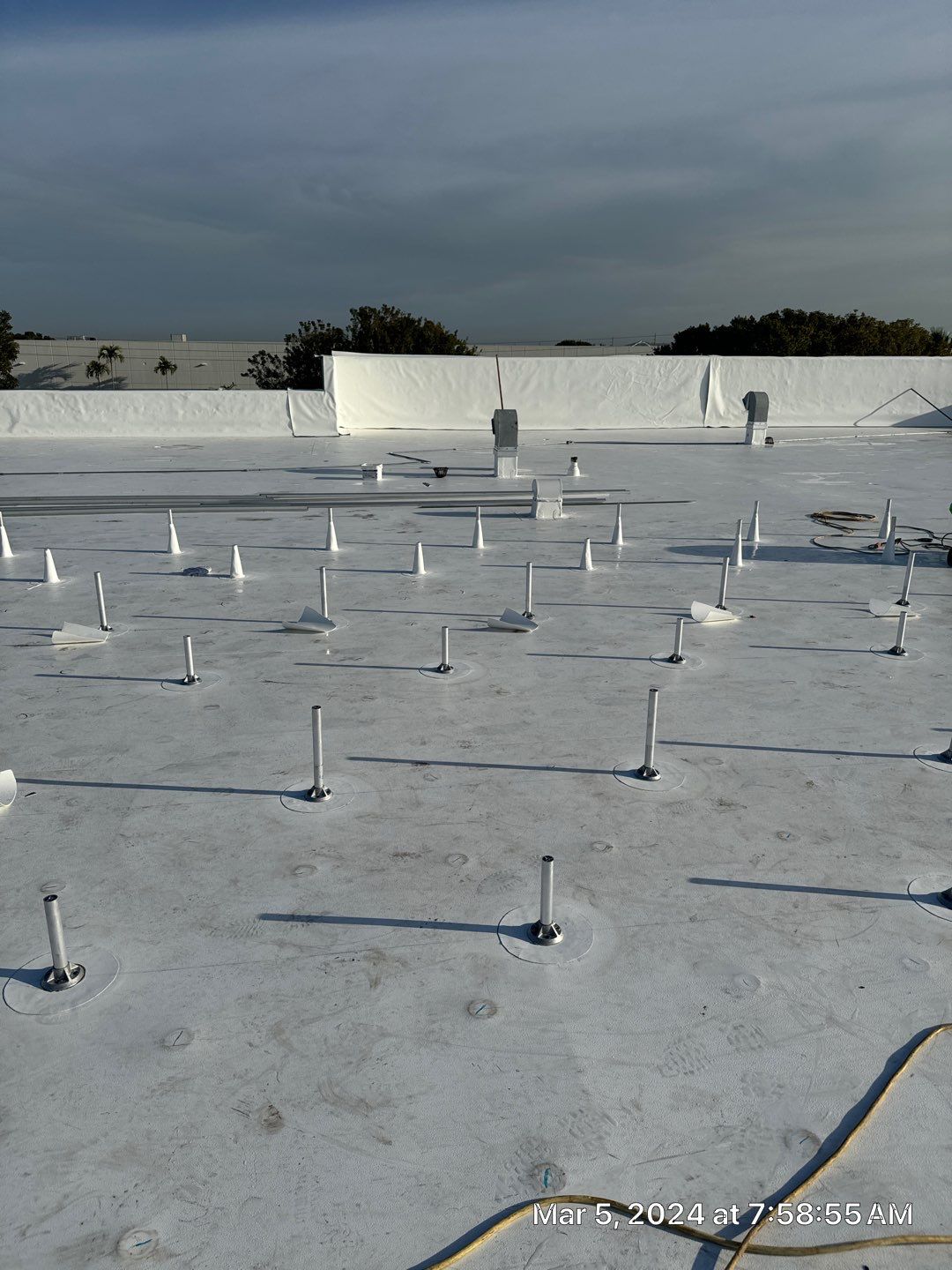 White TPO Membrane Roof Replacement at Doral Commercial Building by AJF ROOFING INC
