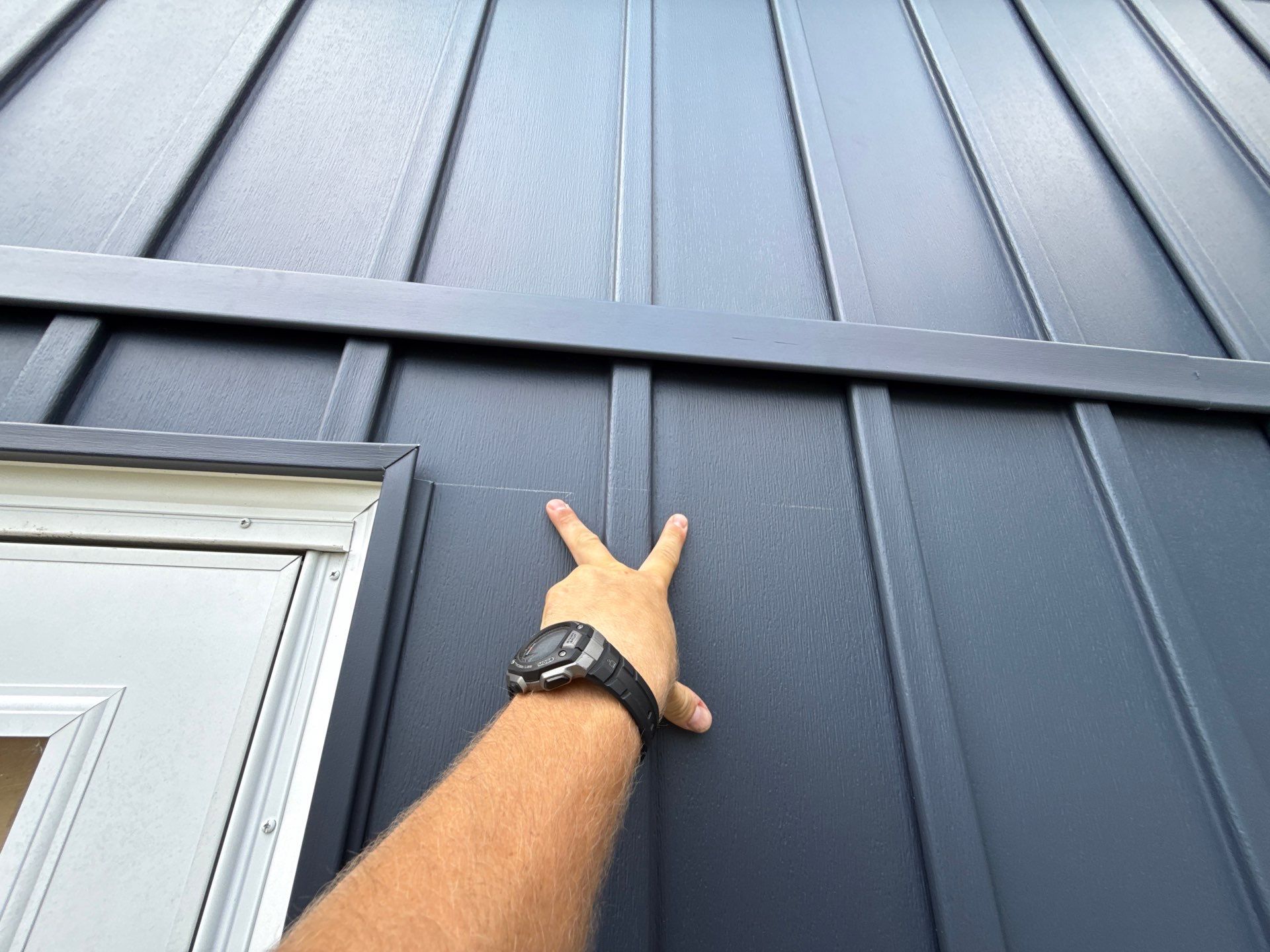 Indigo Board and Batten Siding and Window Replacement in Smithville by EEC Windows, Siding & Roofing