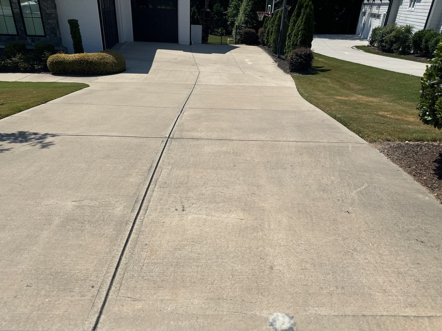Concrete Driveway, Wood Playset using Wood Sealant and Concrete Sealant by DuraSeal