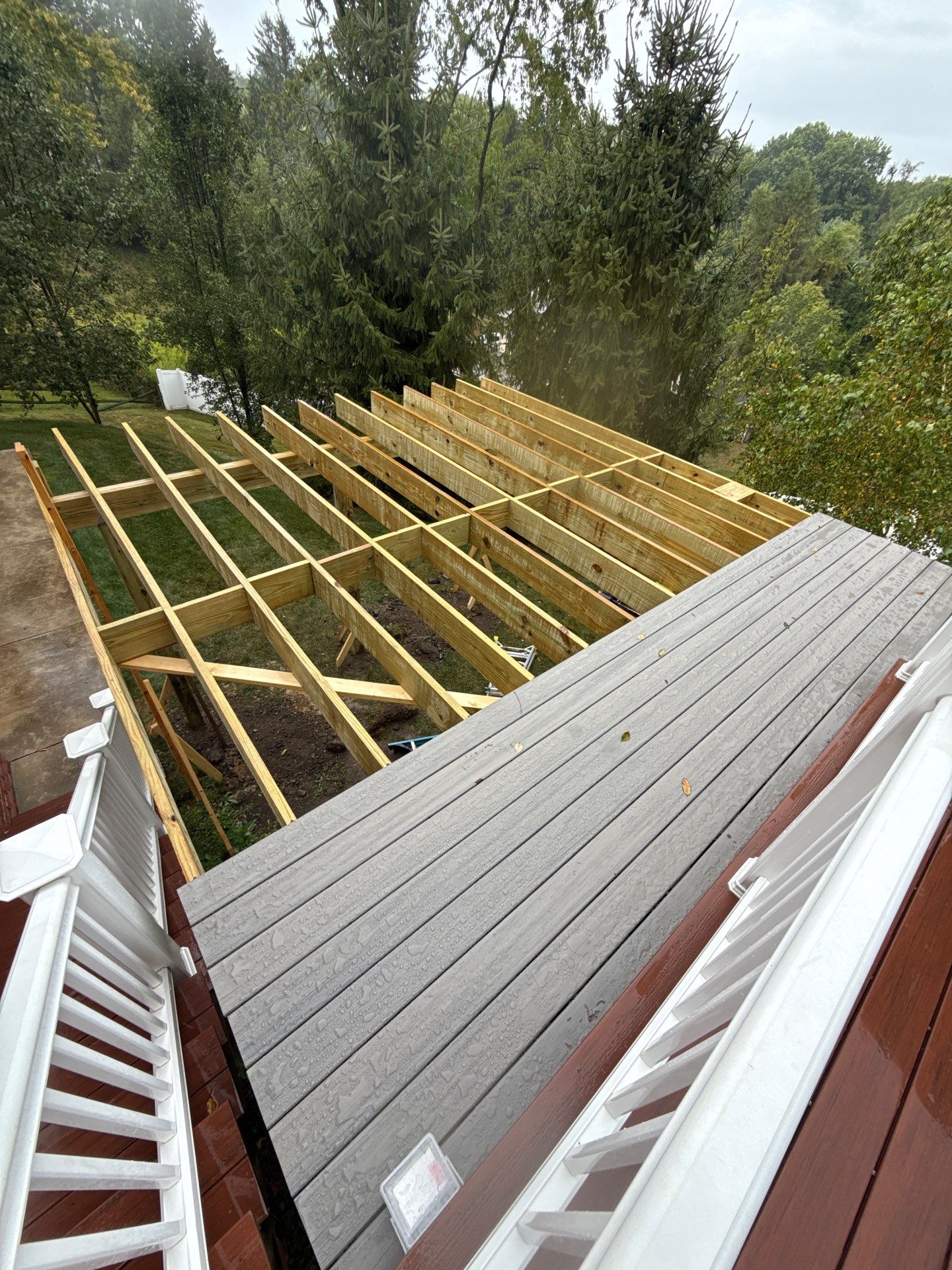 Deck extension  by Cousins Roofing Siding & Decks