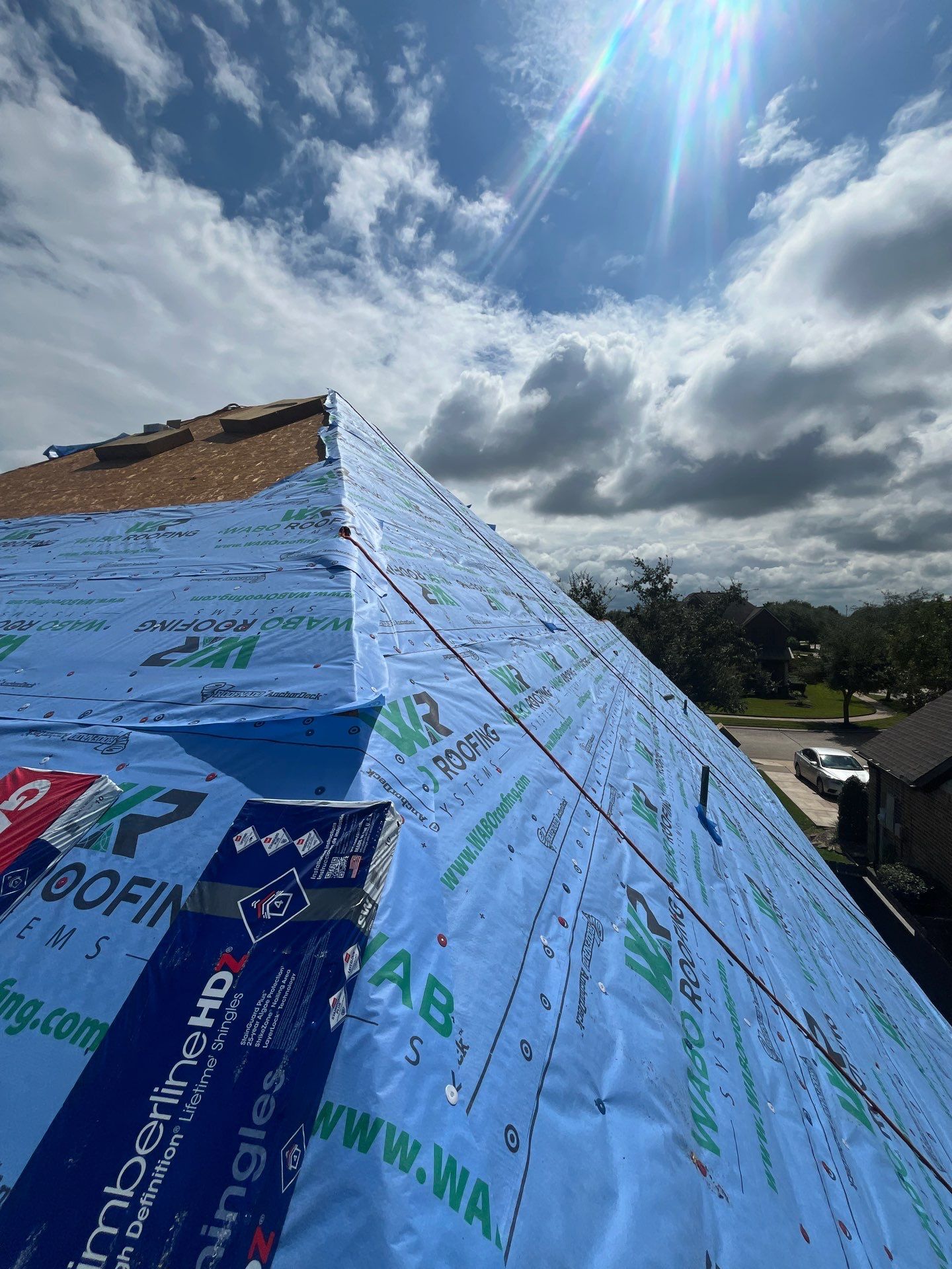 Residential Roofing Installation using GAF Timberline HDZ (weathered wood) by WABO Roofing Systems 