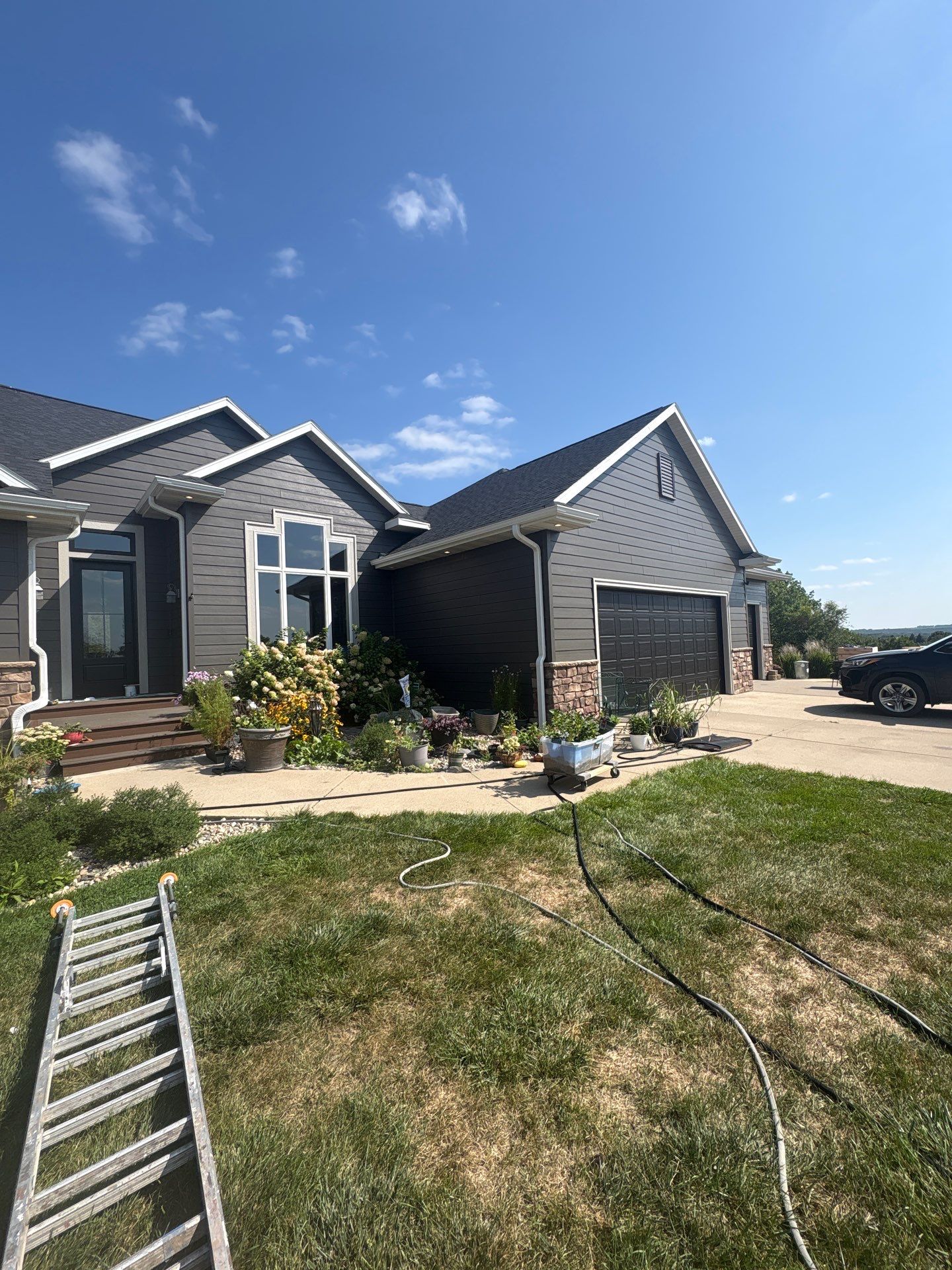 Sioux Falls Residential Exterior Painting and Siding Refresh by Select Painting, Coatings & Garage Cabinets