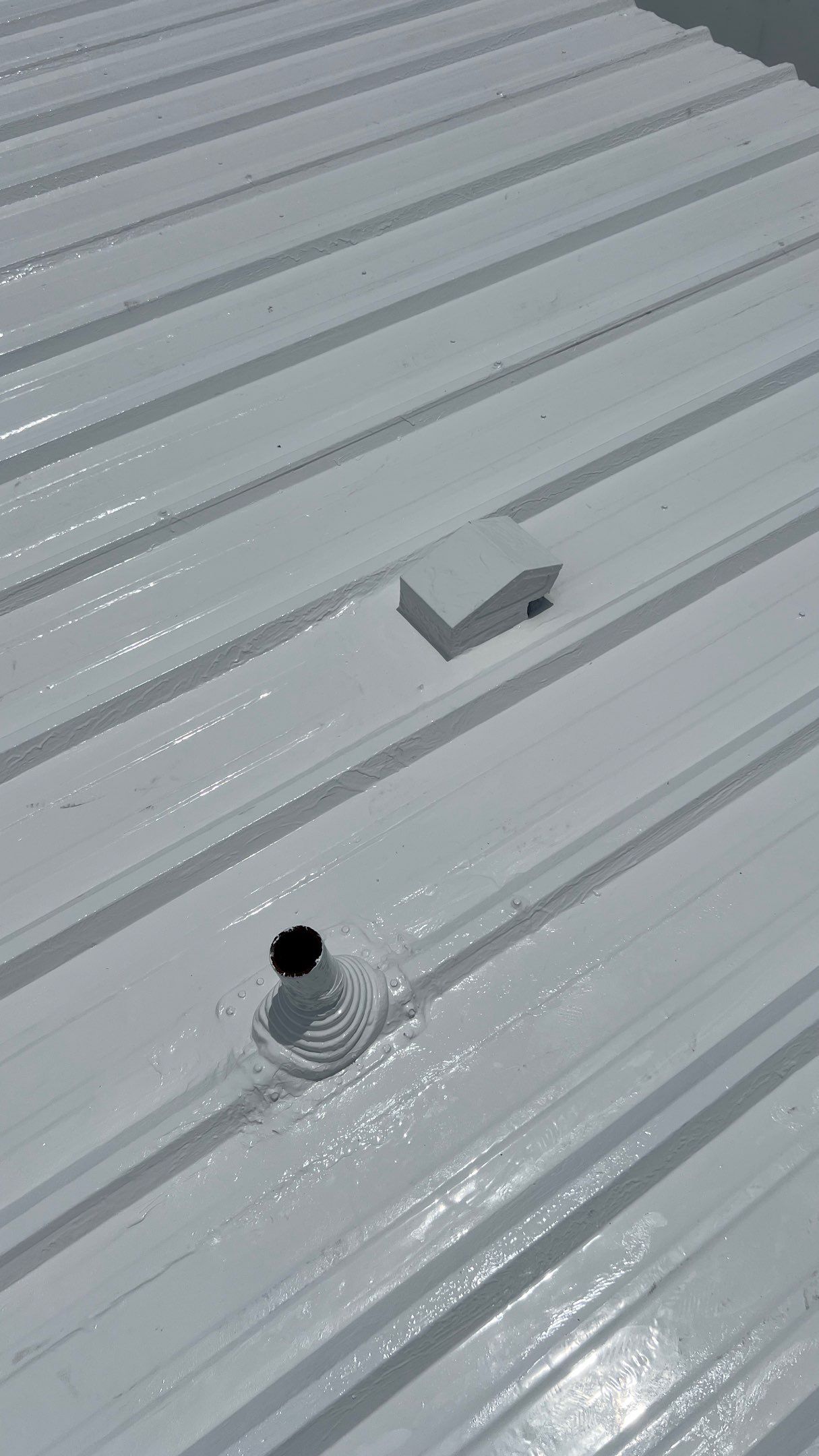 Commercial Roofing Installation using TRP #924 Eterna-Sil Premium Silicone Roof Coating by Harvey Roofing & Construction