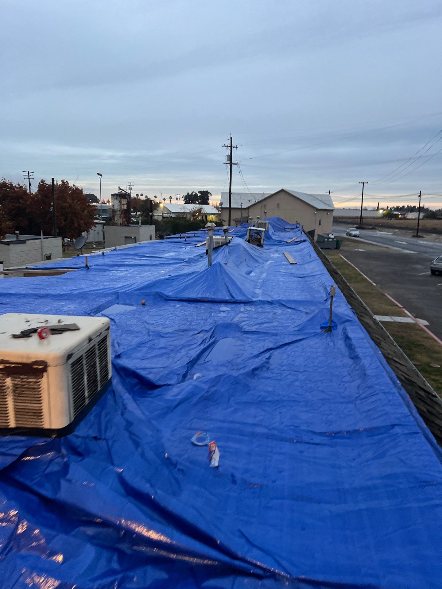 Emergency Roof Tarp Service - Fresno, CA by Grandmark Service Company