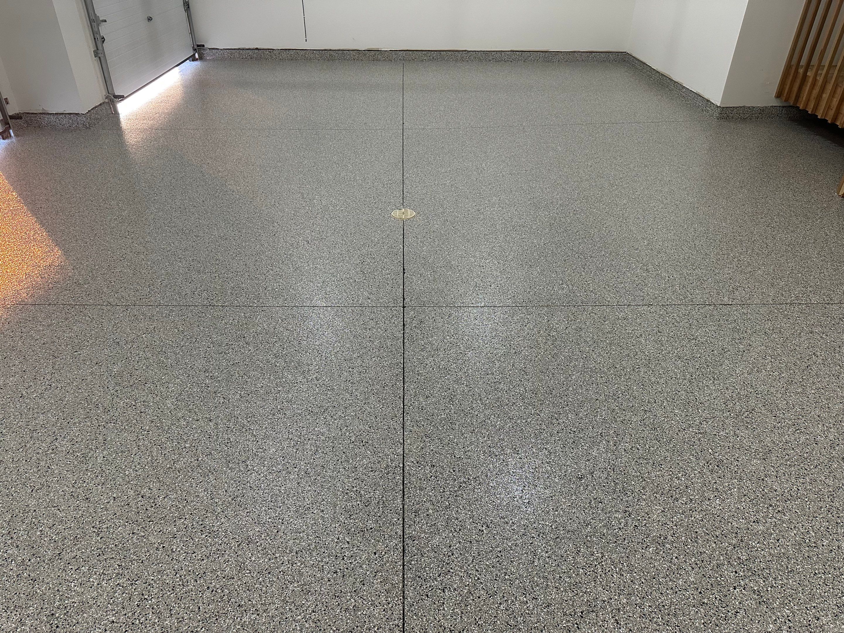 Cabin Fever Decorative Flake Garage Floor Coating in Sioux Falls by Select Painting, Coatings & Garage Cabinets
