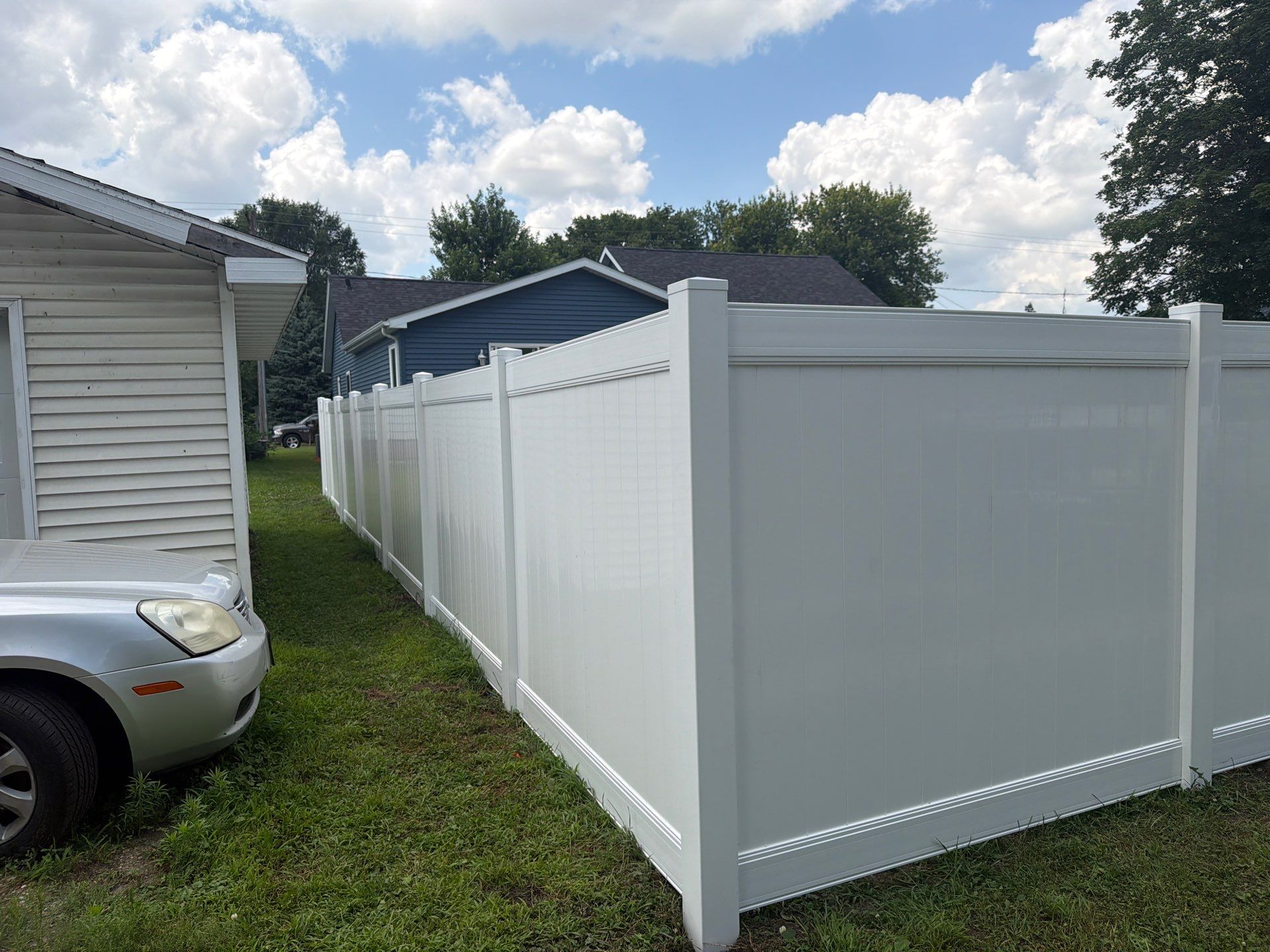 White Vinyl Privacy Fence Installation in Waterloo, Iowa by Perfect Picket Fence and Stain