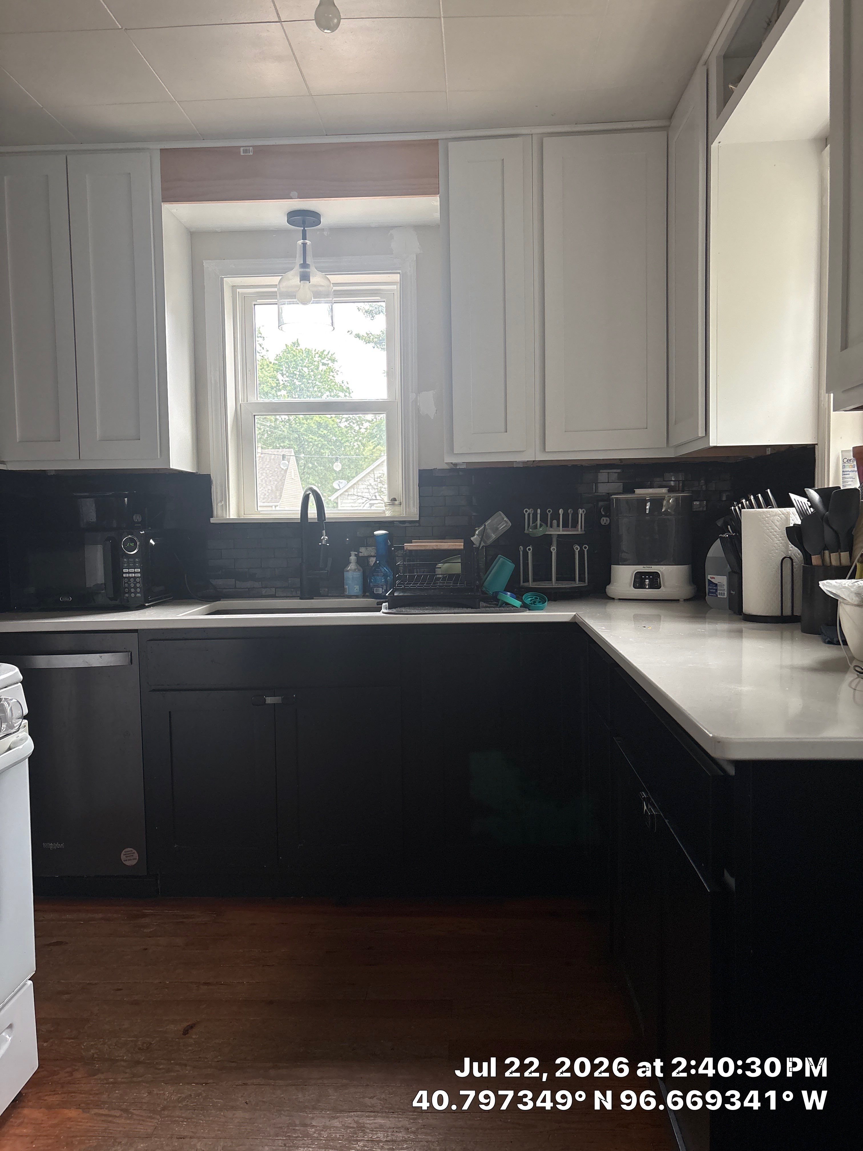 Modern Kitchen Renovation with Two-Tone Cabinetry and Quartz Countertops by CompanyCam Sales Demo