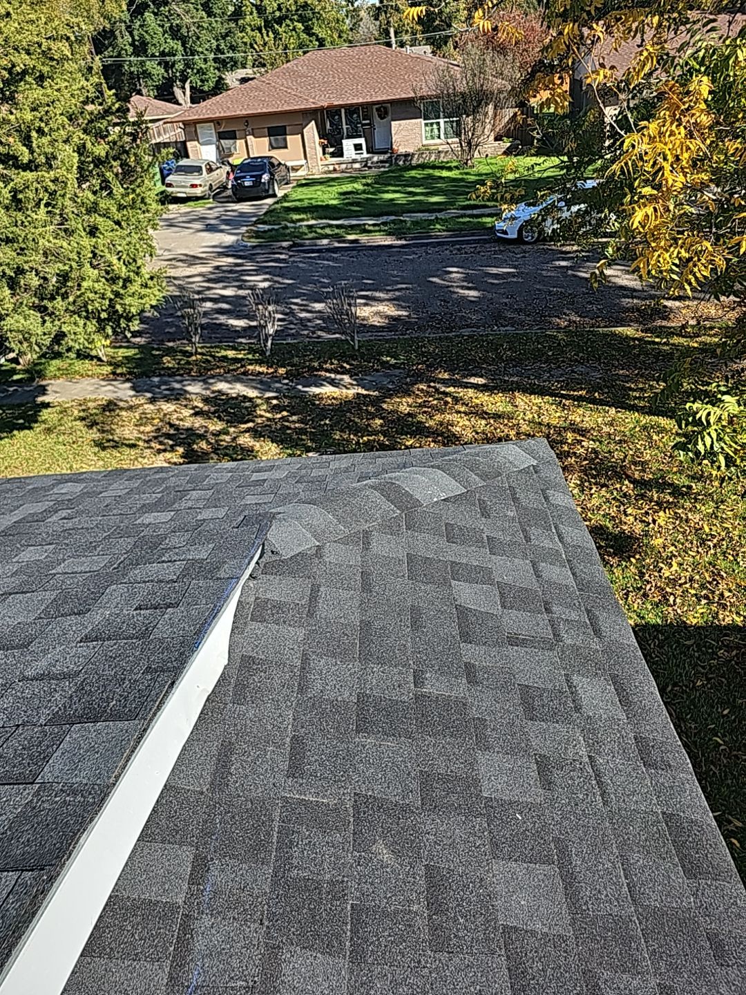 "Full Roof Replacement Due to Hail and Water Damage – Before & After" by road roofing llc