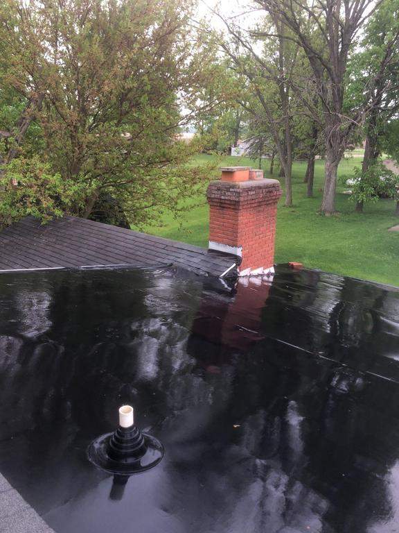 Residential Roofing Installation using 60 mil rubber roof  by Nitro Roofing and Construction