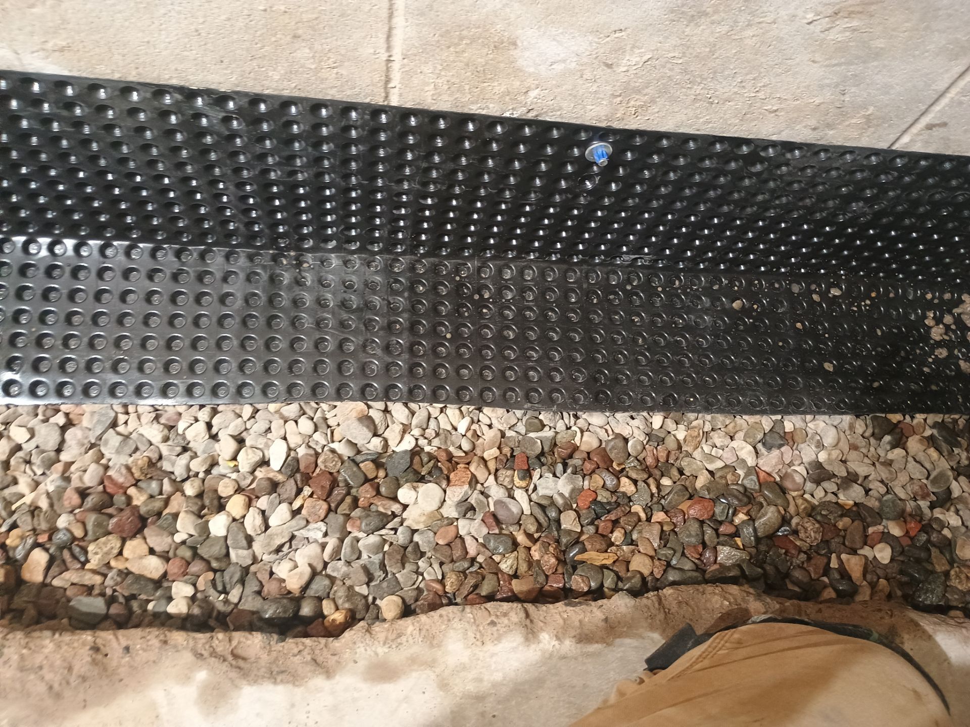 Interior Drain Tile Installation in Minnetonka, MN by Waterproofing Northeast