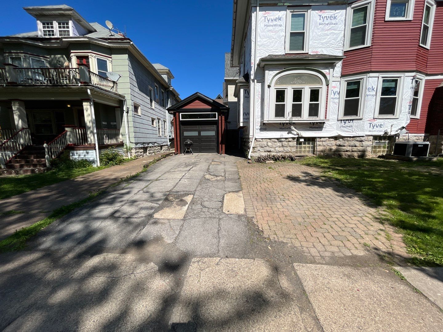 Exterior Renovations- Siding, Stamped Concrete, Porch, and Railings by Ivy Lea Construction