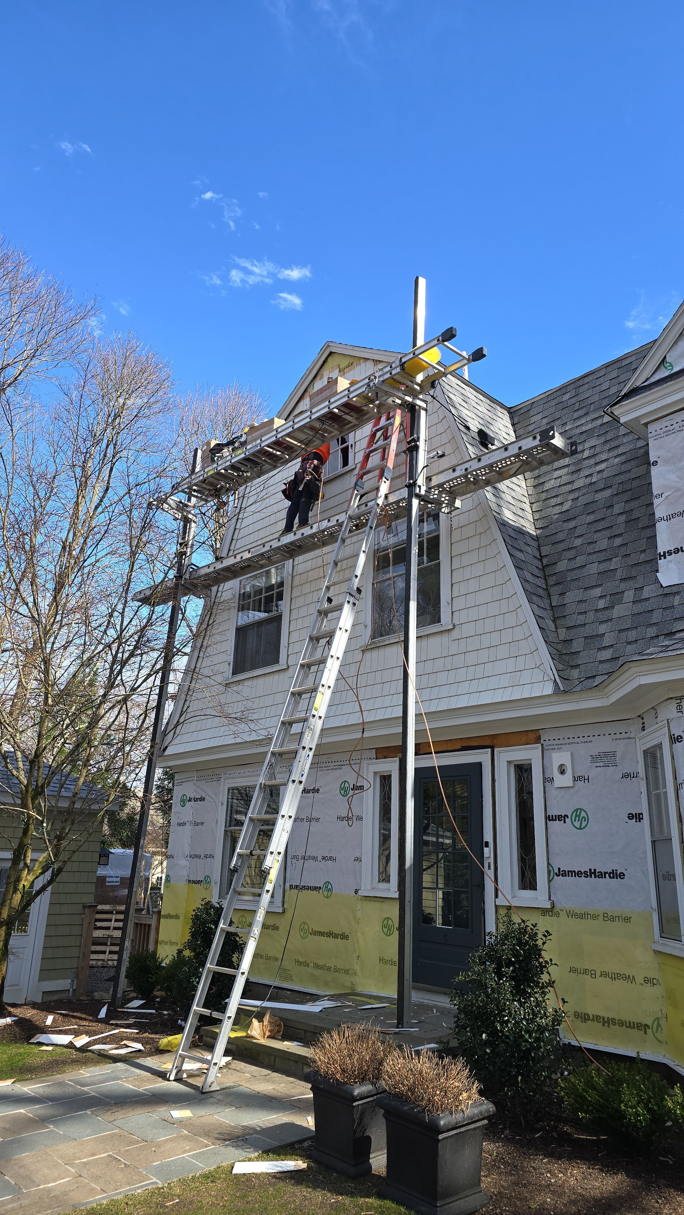 White cedar shingles and windows in Wayland, MA by UBrothers Construction