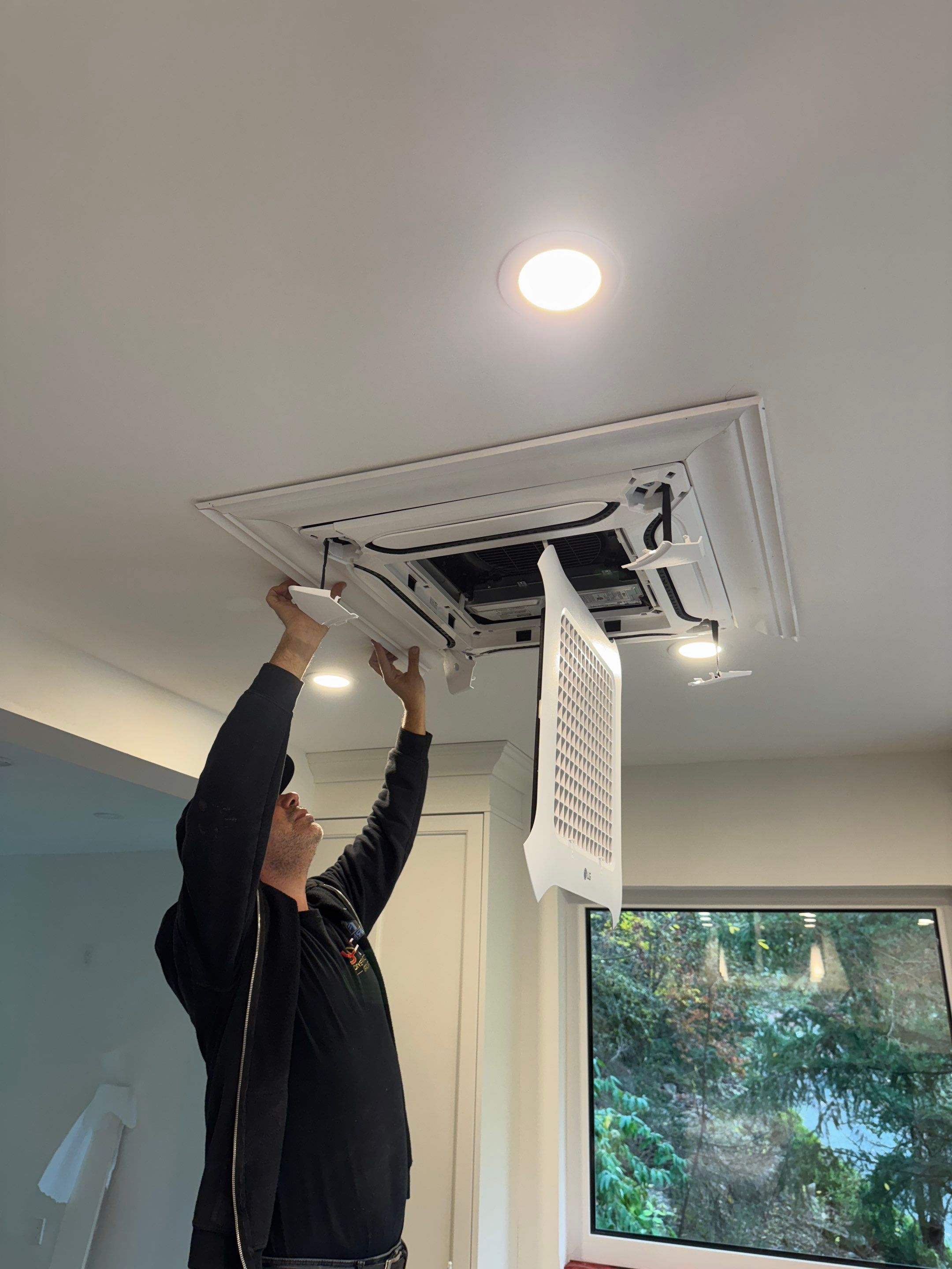 West Vancouver Custom Millwork: Heat Pump Trim & Window Finishing by YVR Construction Group