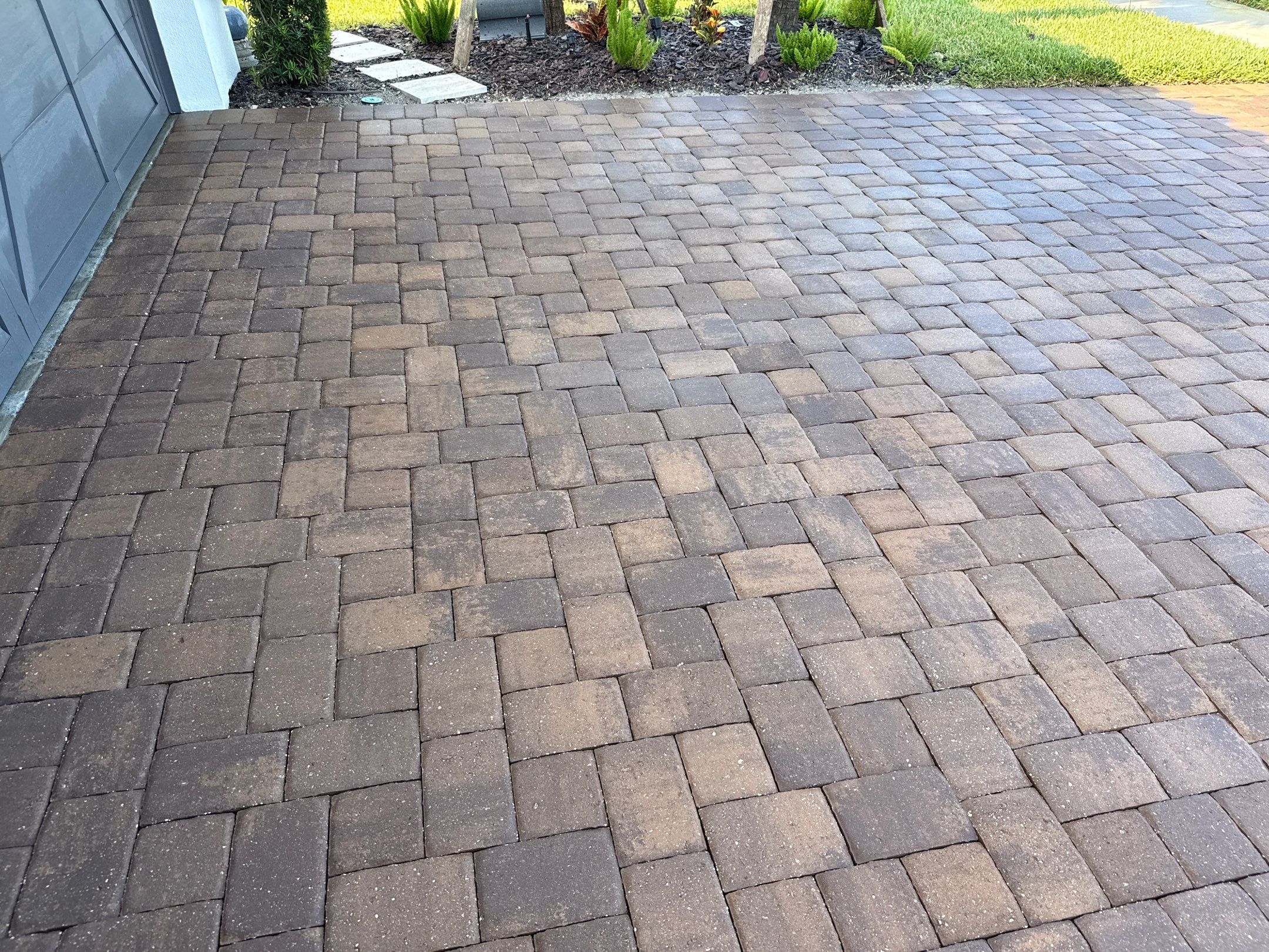 Oil Stain Removal on Paver Driveway | Esplanade at Artisan Lakes, Palmetto FL by Sunshine AquaWash