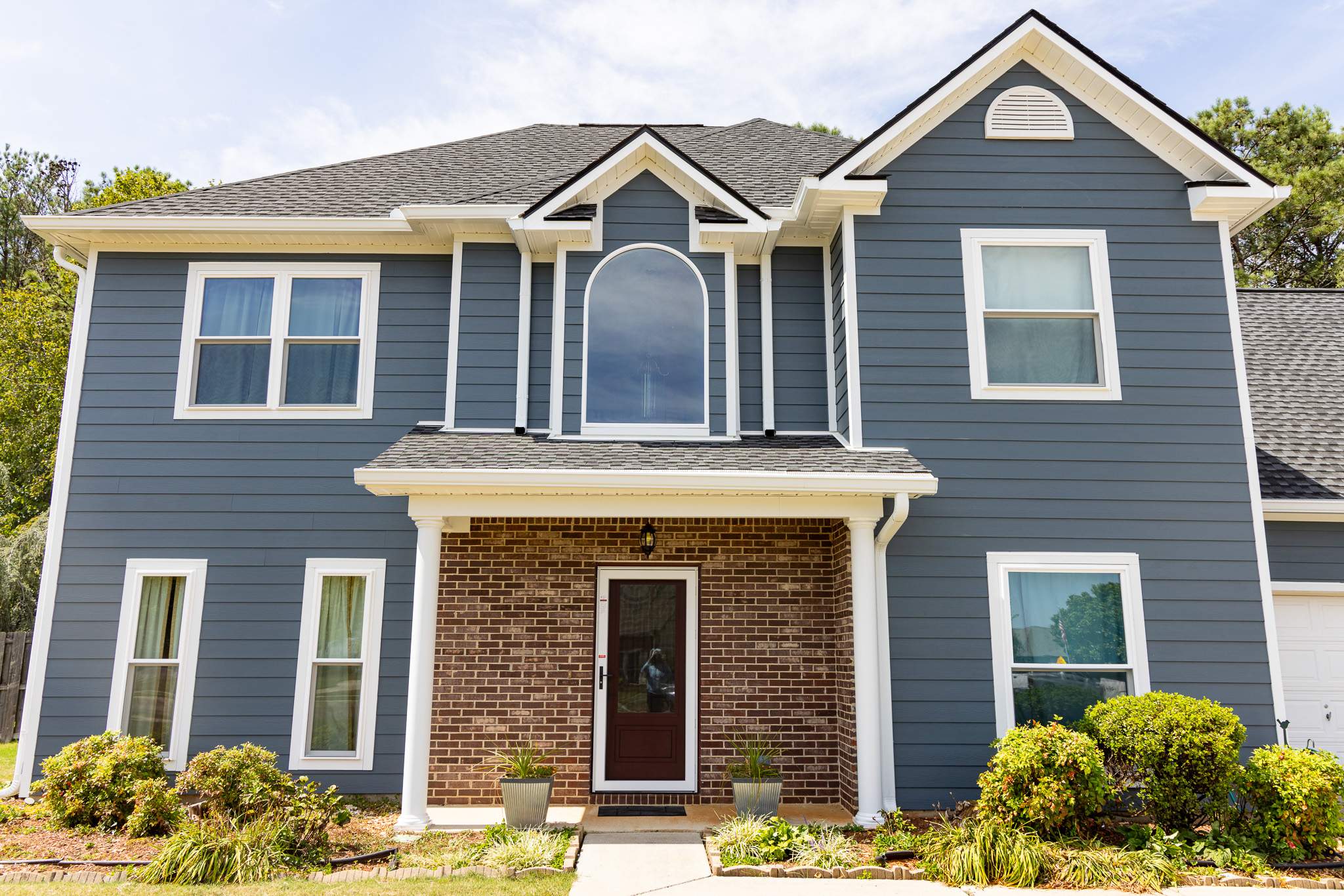 Evening Blue Hardie + Windows by Freedom Exteriors