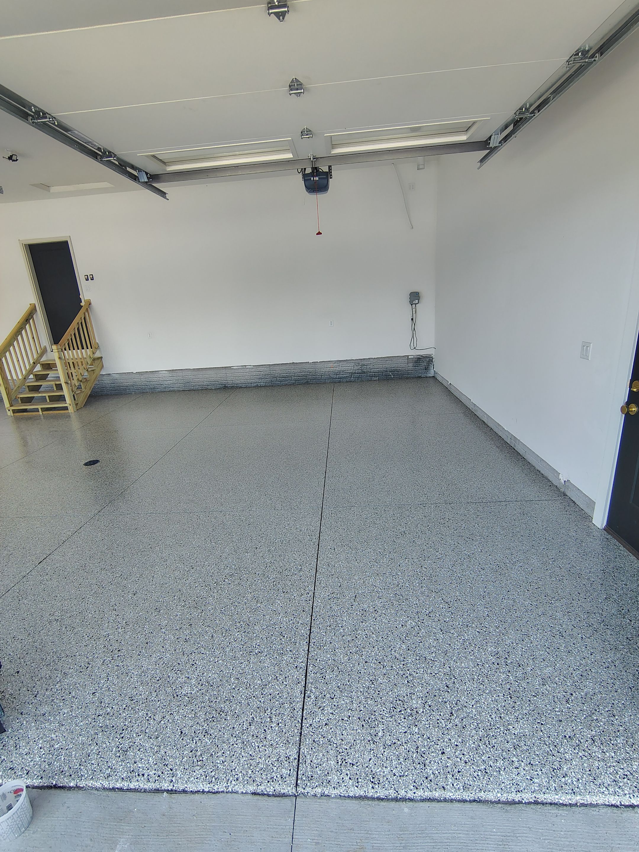 Cabin Fever Decorative Flake Garage Floor Coating in Sioux Falls by Select Painting, Coatings & Garage Cabinets