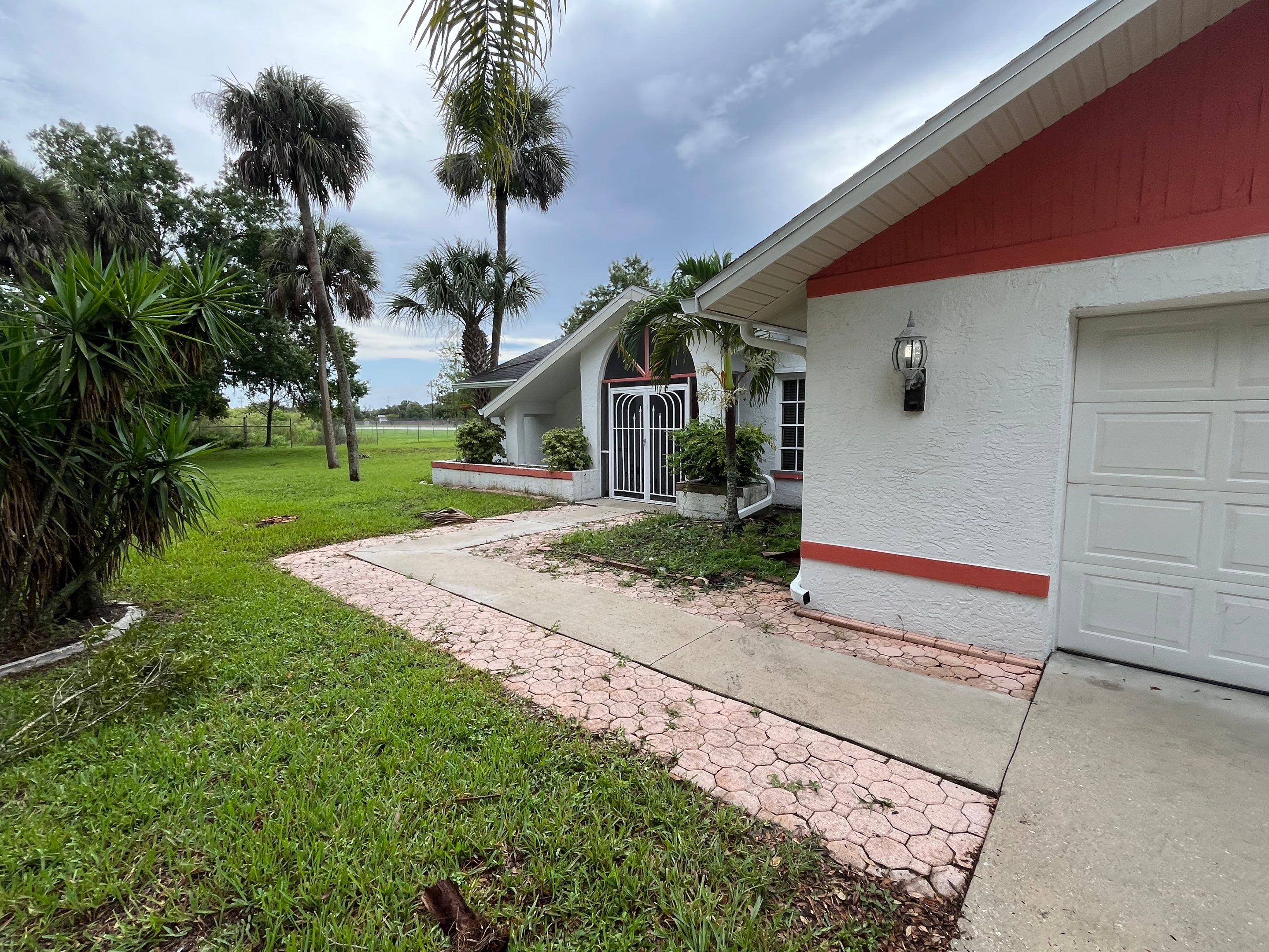White Seamless Gutters with Splash Guards in North Fort Myers FL by Gutter Professor   by Gutter Professors