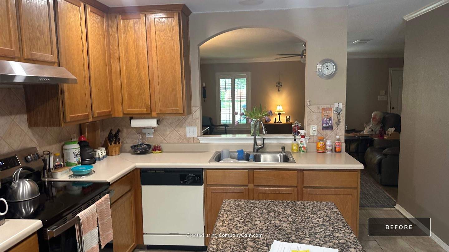 Live Oak Kitchen Refresh Featuring White Shaker Cabinets and Navy Island by Legacy Bath and Kitchen 