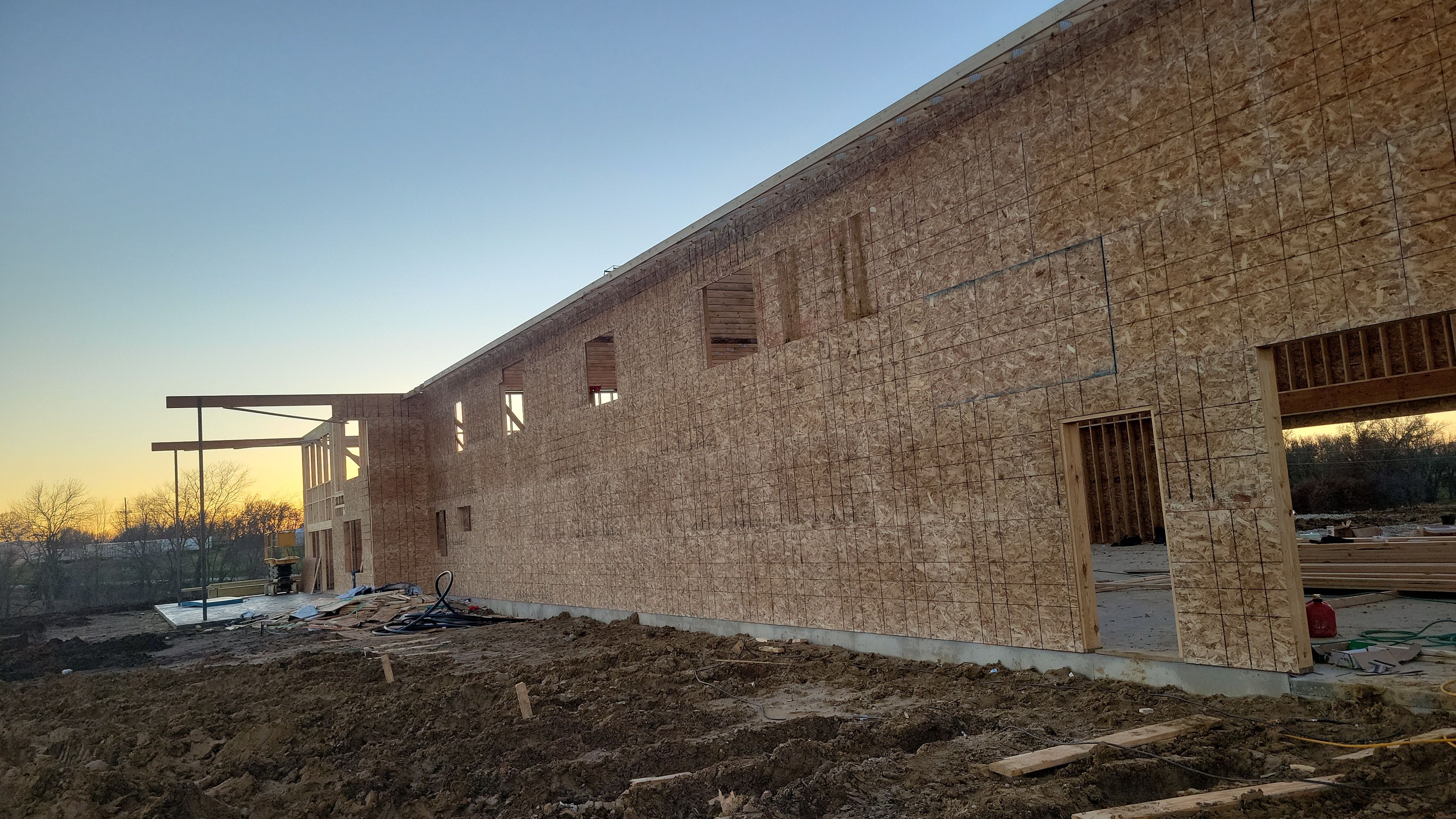 New Home construction w/ board and batten sides and metal roof  by Miles Construction 