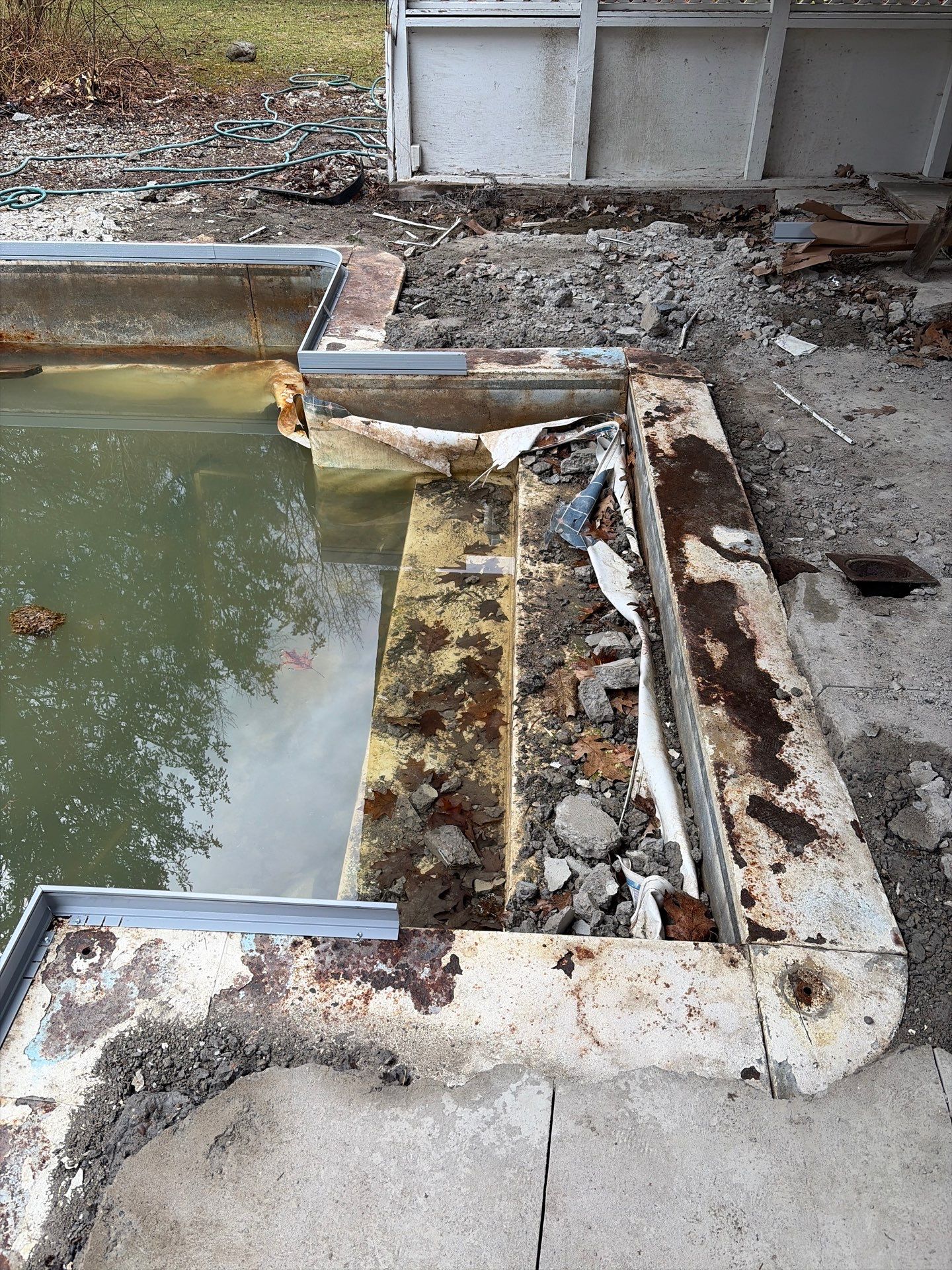 In-Ground Swimming Pool Renovation and Concrete Decking in Old Chatham by Cypress Pools and Spas