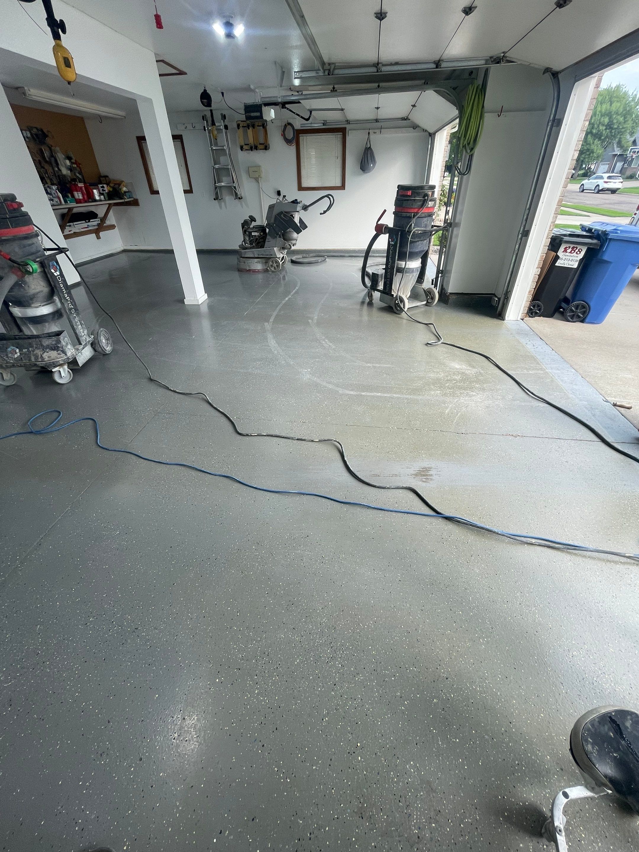 Multi-Car Garage Concrete Coating with Coyote Flake Finish in Sioux Falls by Select Painting, Coatings & Garage Cabinets