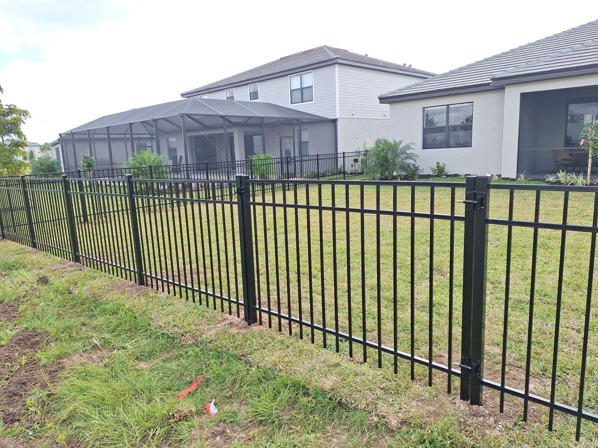 Aluminum Fence Installation using 4ft 3 Rail Black Aluminum Fence by Asap fence and gates, LLC