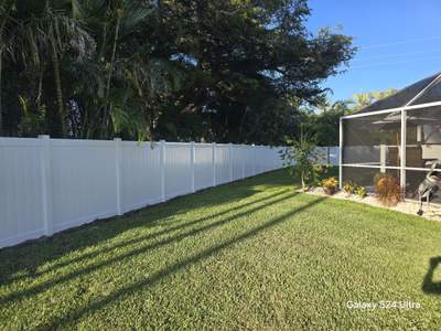 White Vinyl Privacy Fence and Double Gate Installation in Fort Myers
