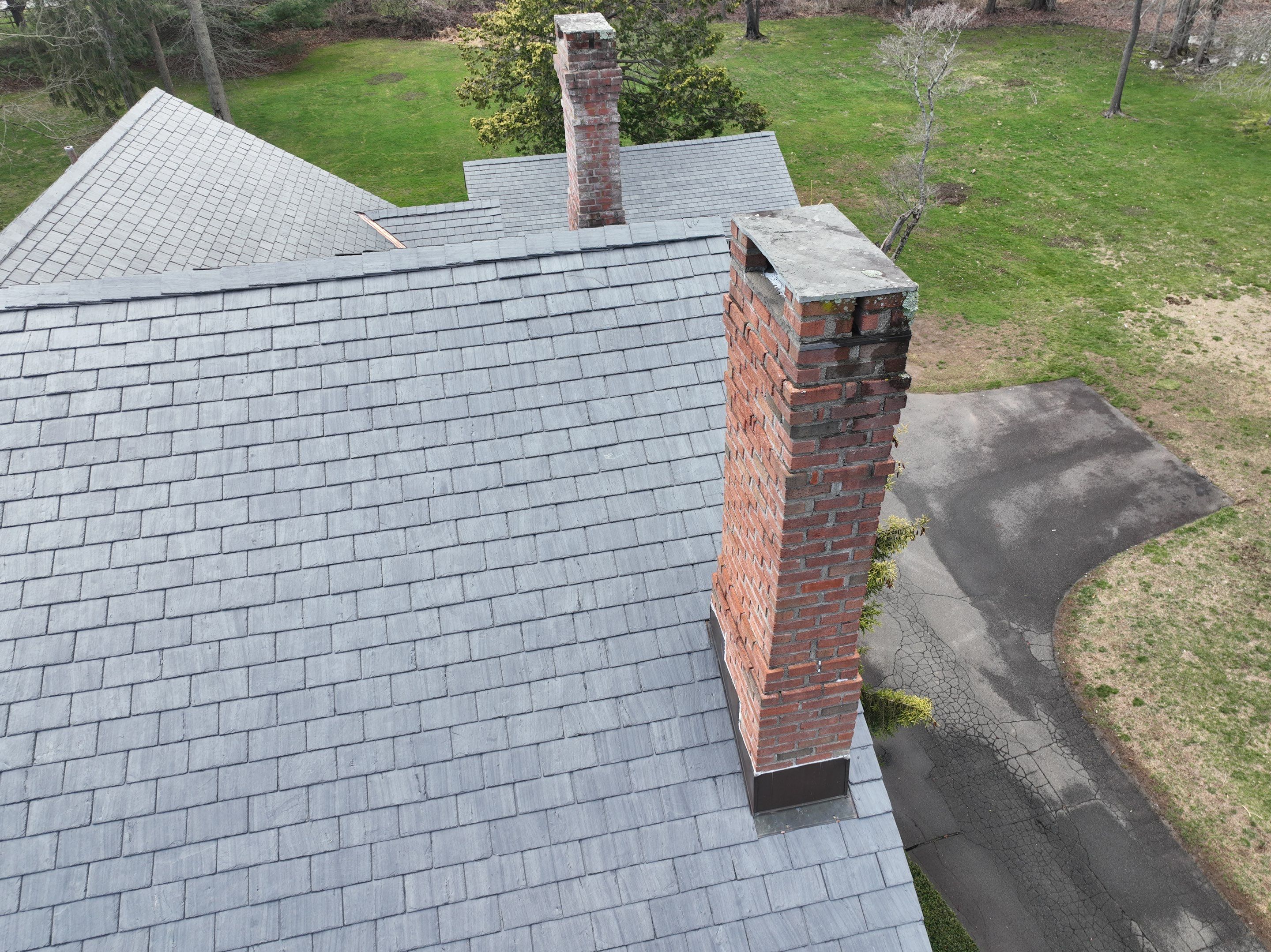 Residential Roofing Installation using Vermont Slate by A Plus Exterior
