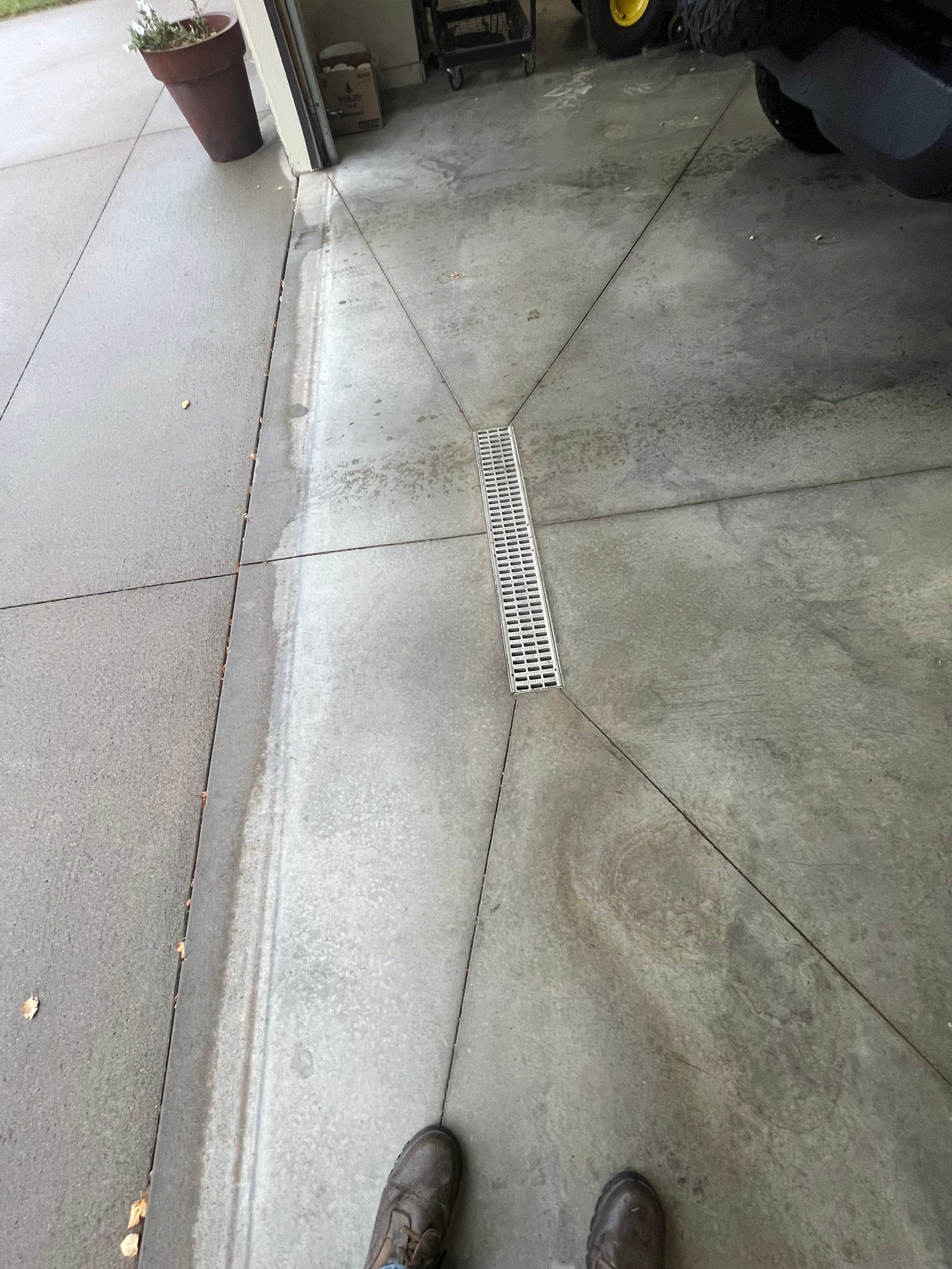 Coyote Flake Garage Floor Coating in Sioux Falls with Trench Drain by Select Painting, Coatings & Garage Cabinets