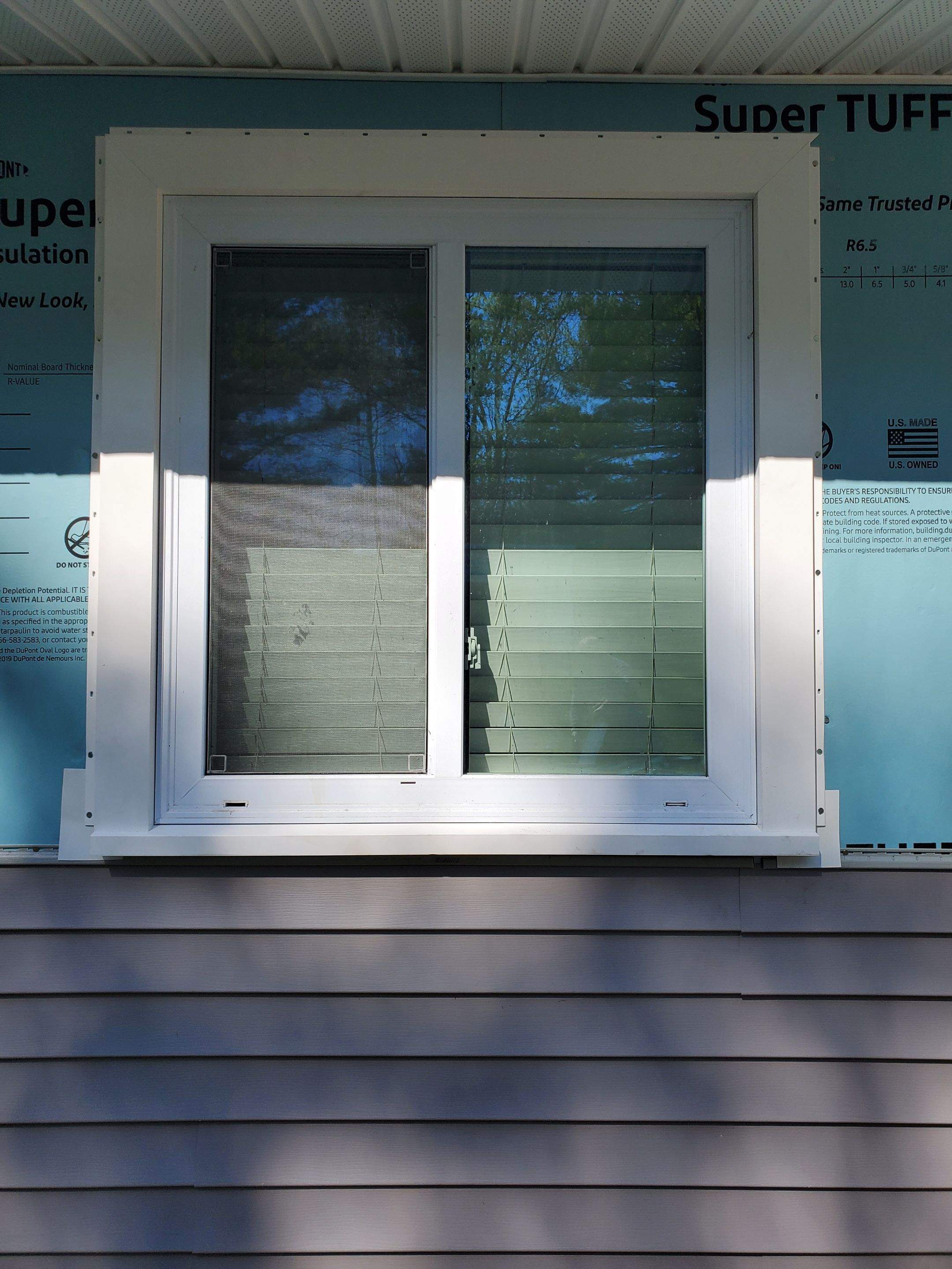 Siding Installation using insulation, PVC trim and vinyl siding by UBrothers Construction