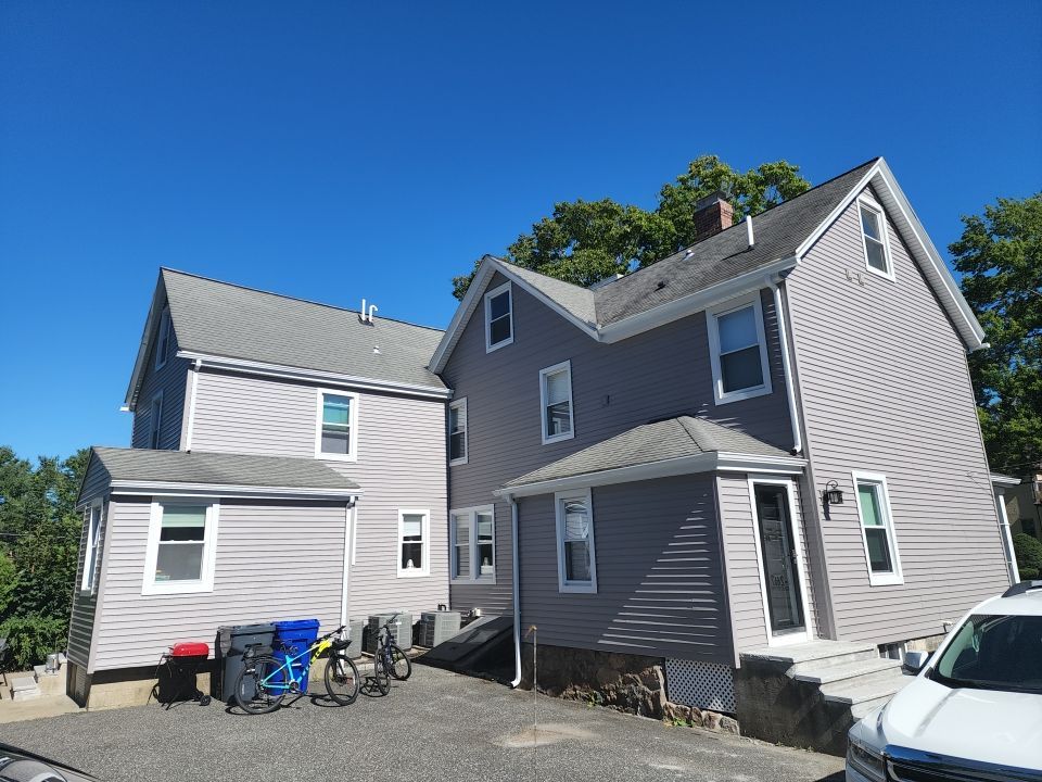 Vinyl siding layover project for 2 family in Wellesley, MA by UBrothers Construction