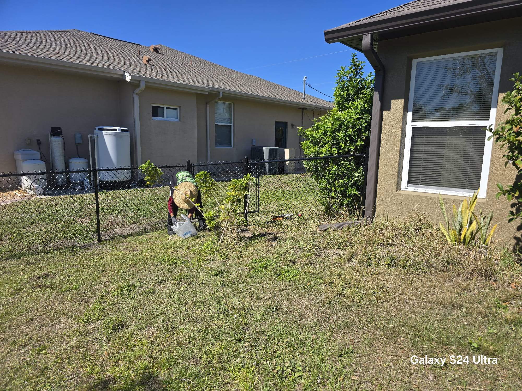Residential Black Vinyl-Coated Chain Link Fence Installation in North Port by True Fence LLC